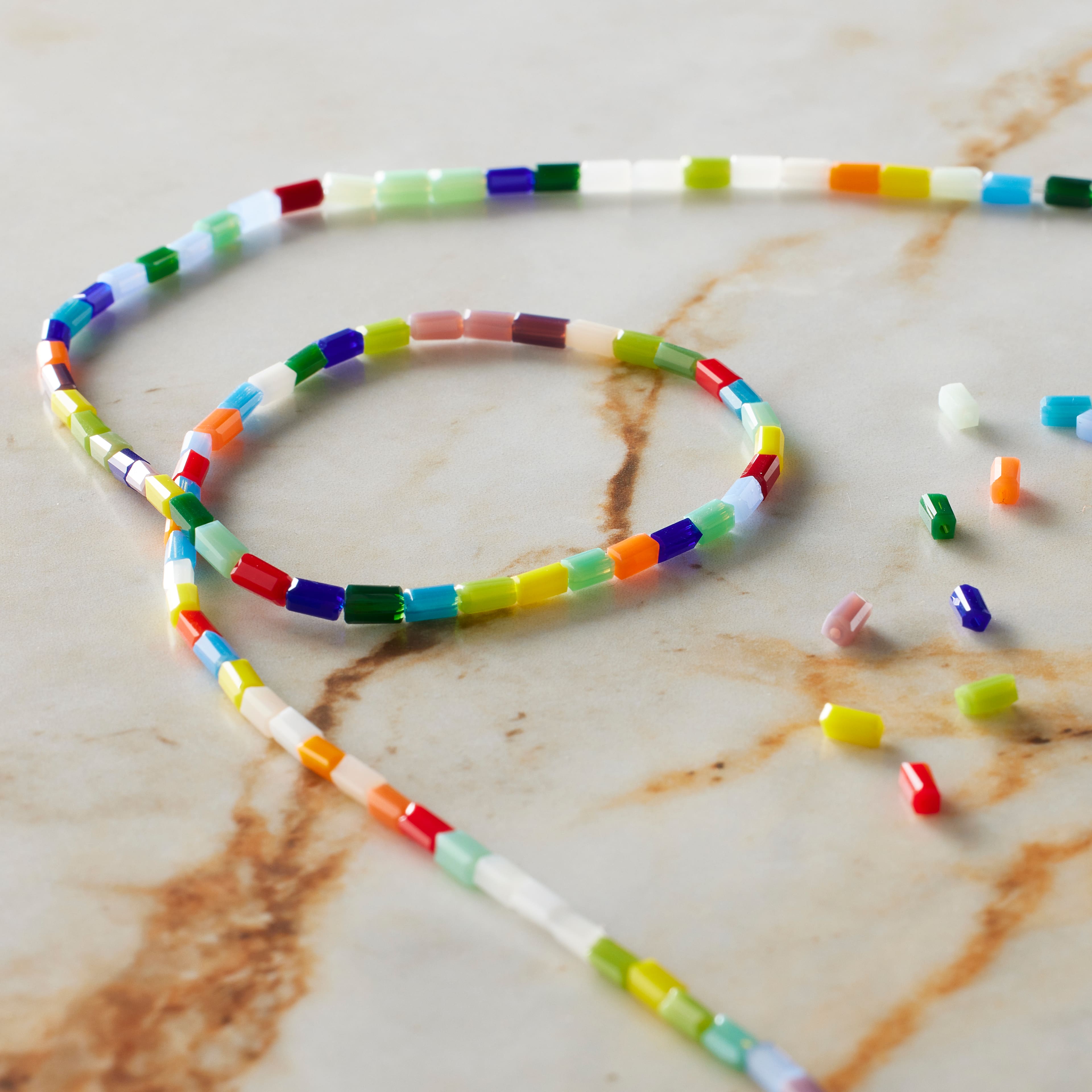 12 Pack: Multicolor Faceted Glass Tube Beads, 4mm by Bead Landing™