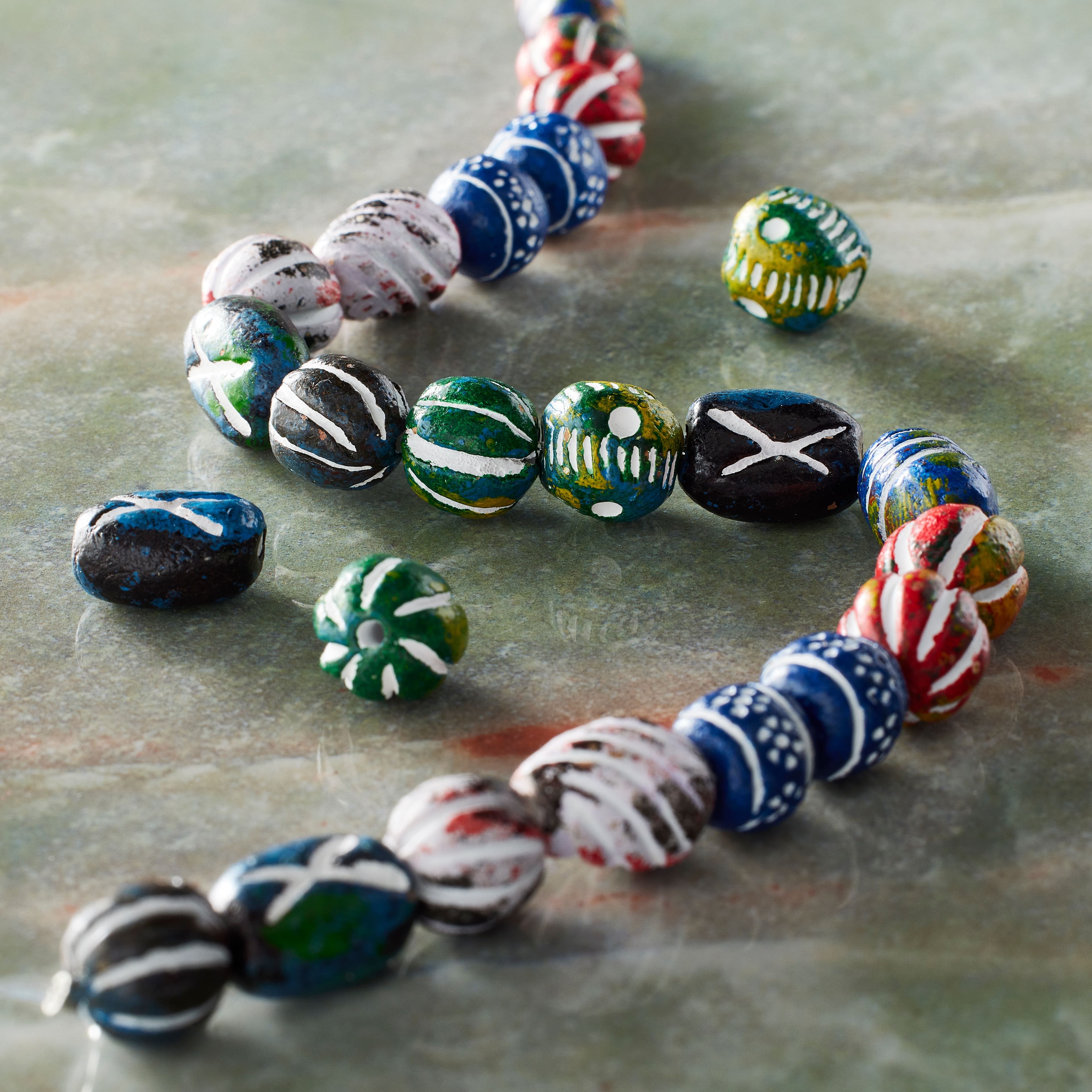 12 Packs: 24 ct. (288 total) Multicolor Clay Mixed Distressed Beads by Bead Landing&#x2122;