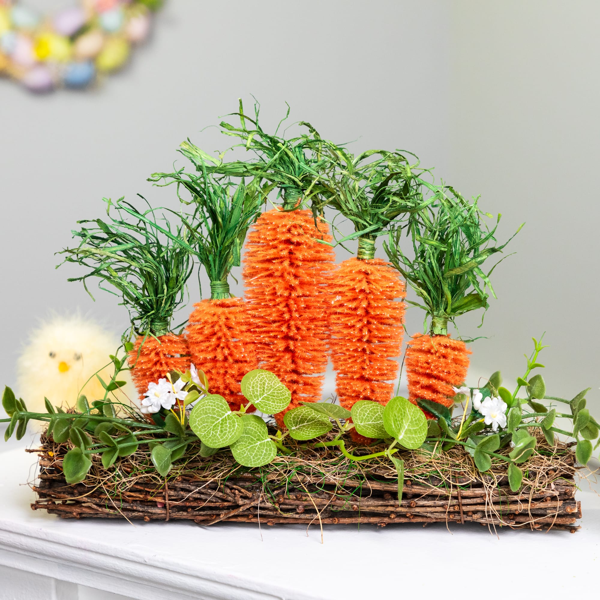 14" x 11.75" Standing Carrots on Floral Foliage Twig Log Easter Décor