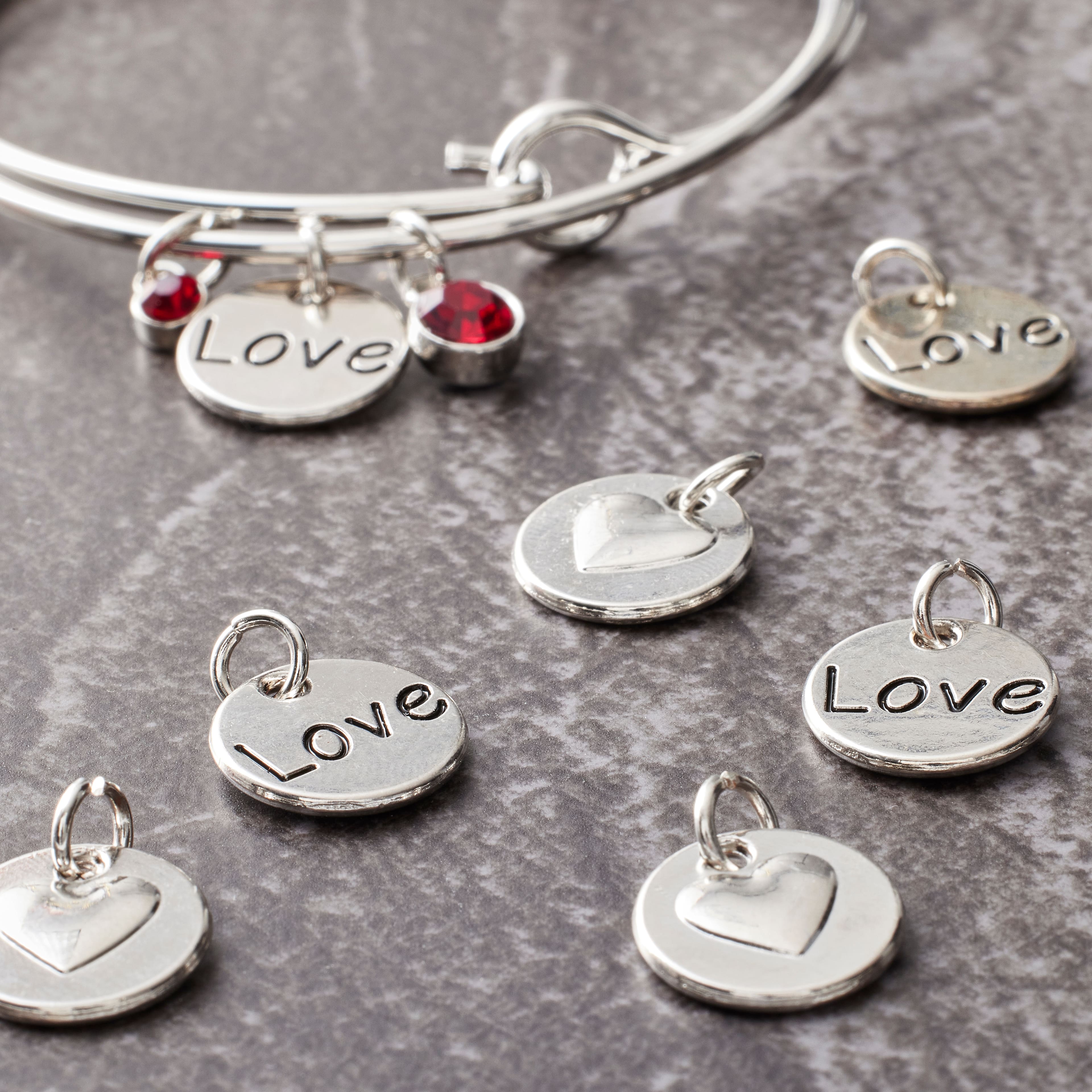 12 Packs: 12 ct. (144 total) Rhodium-Colored Reverse Heart Charms by Bead Landing™