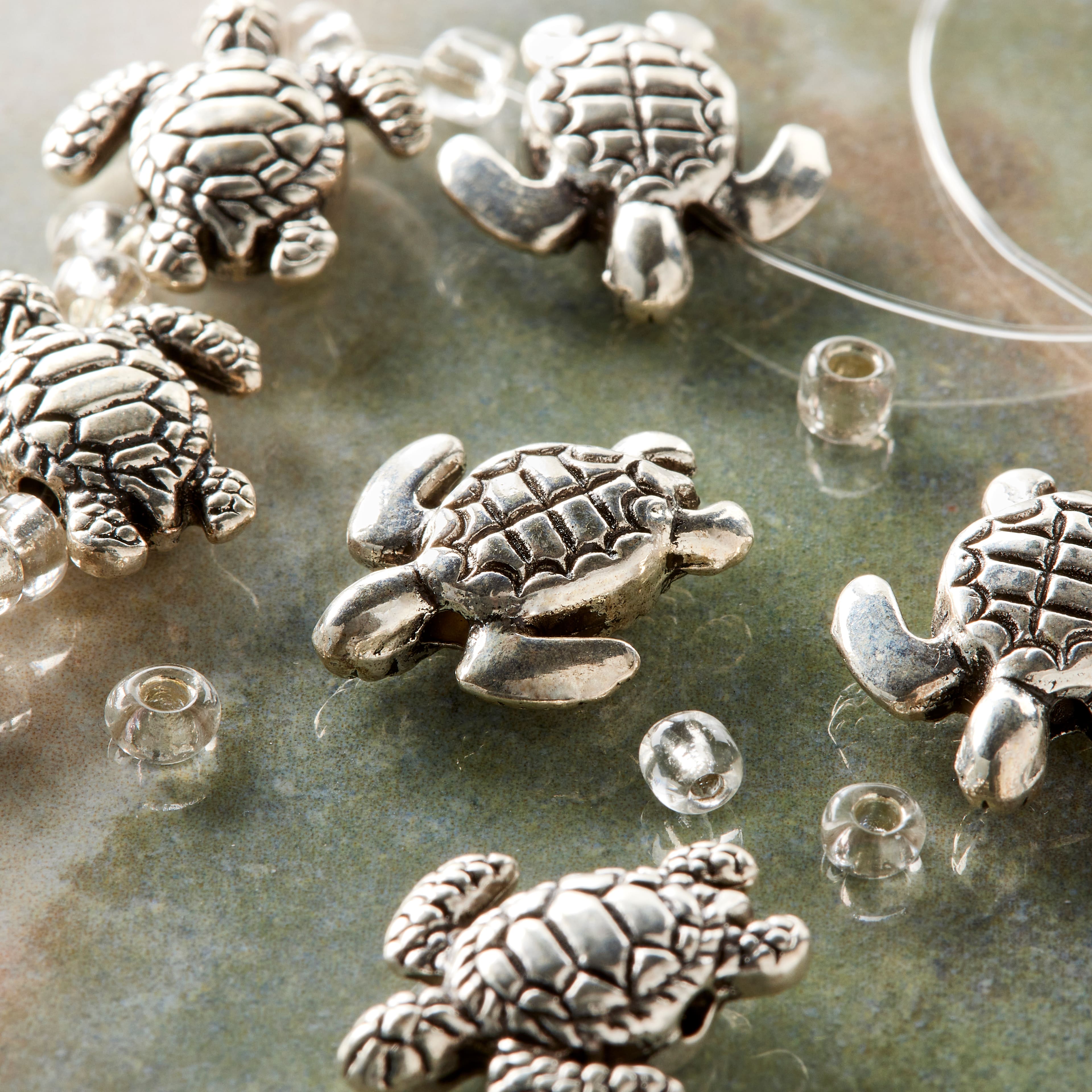 12 Packs: 8 ct. (96 total) Silver Metal Sea Turtle Beads, 18mm by Bead Landing™