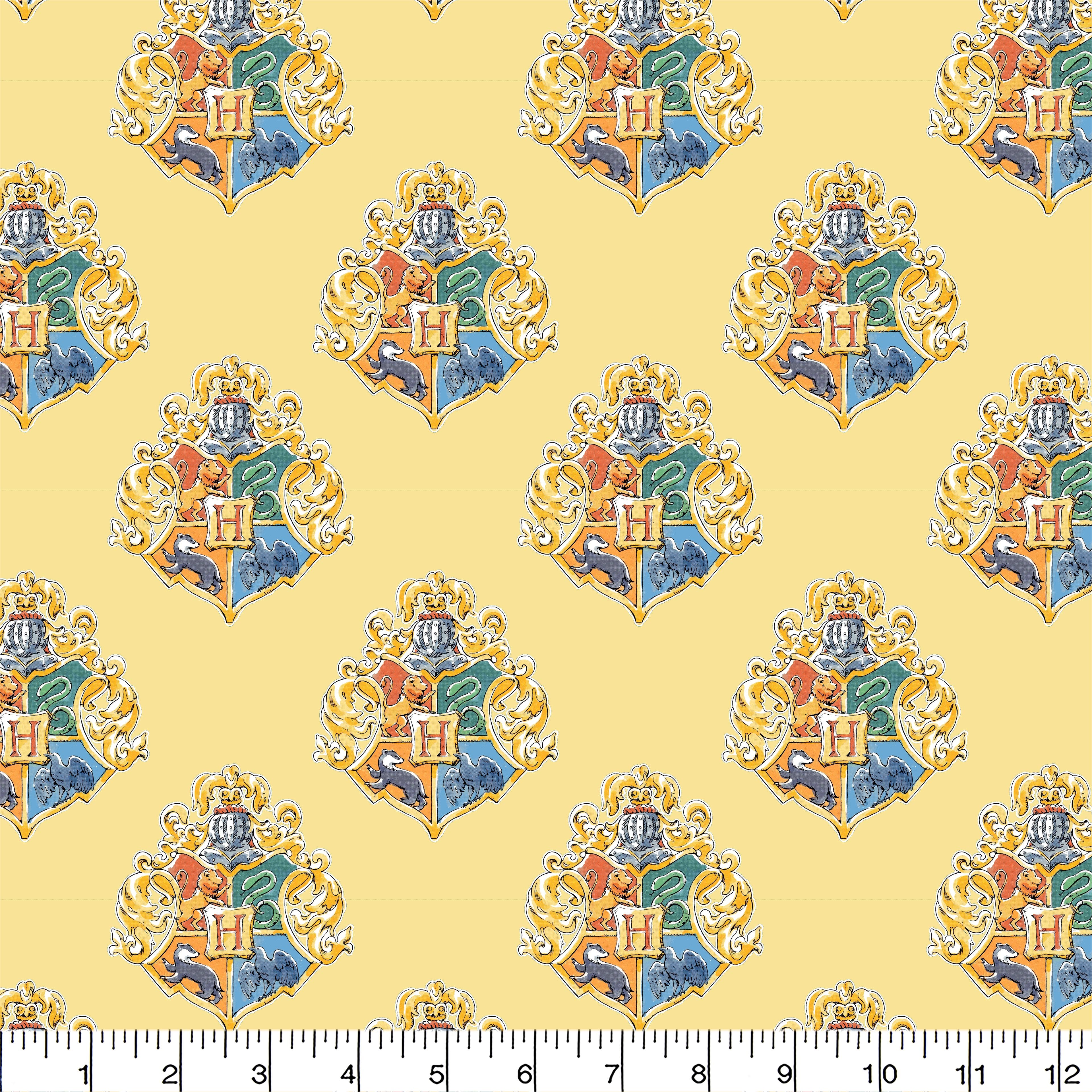 Harry Potter&#x2122; Yellow Watercolor Hogwarts&#x2122; Crest Cotton Fabric