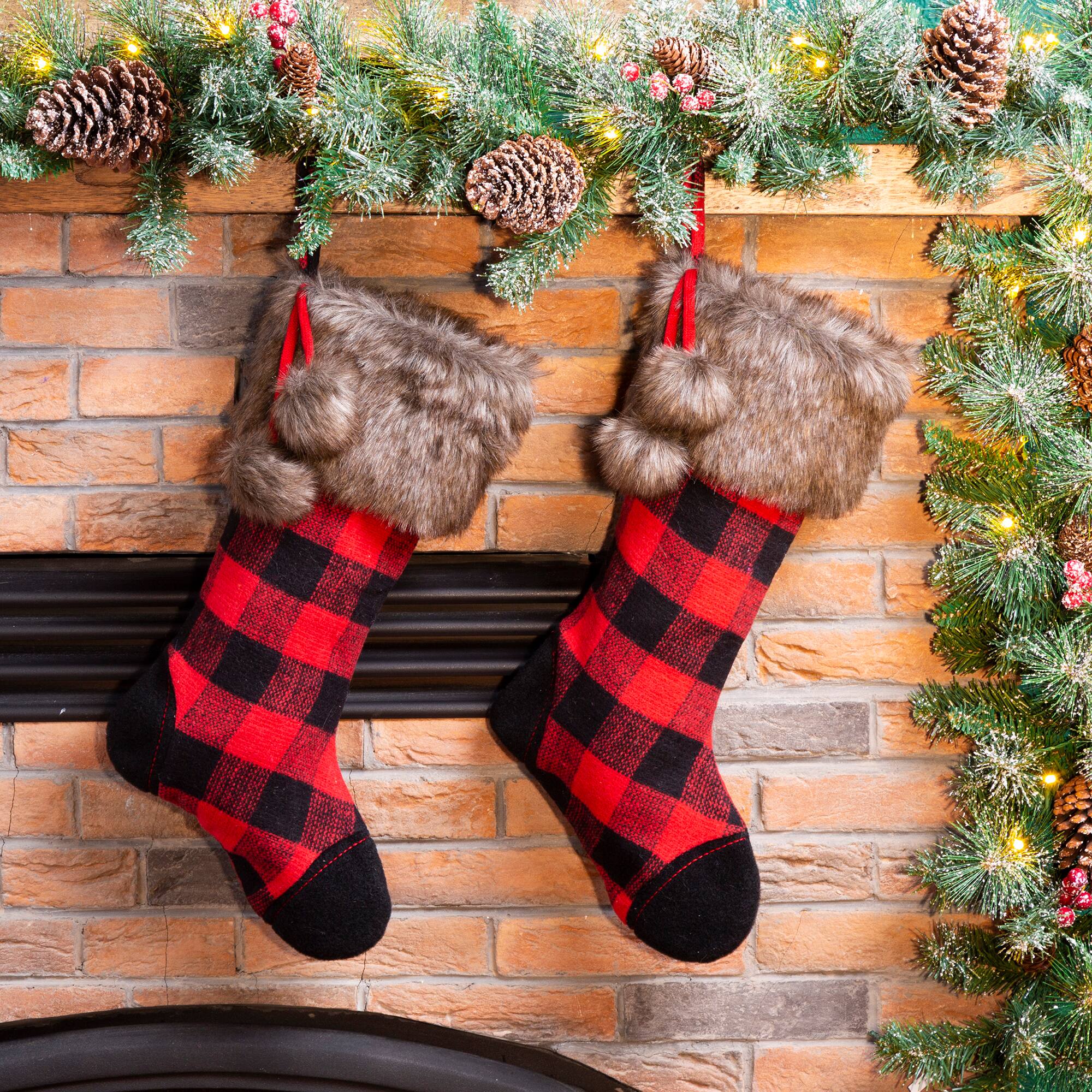 Glitzhome® 21" Black & Red Buffalo Plaid Pompom Stockings, 2ct.