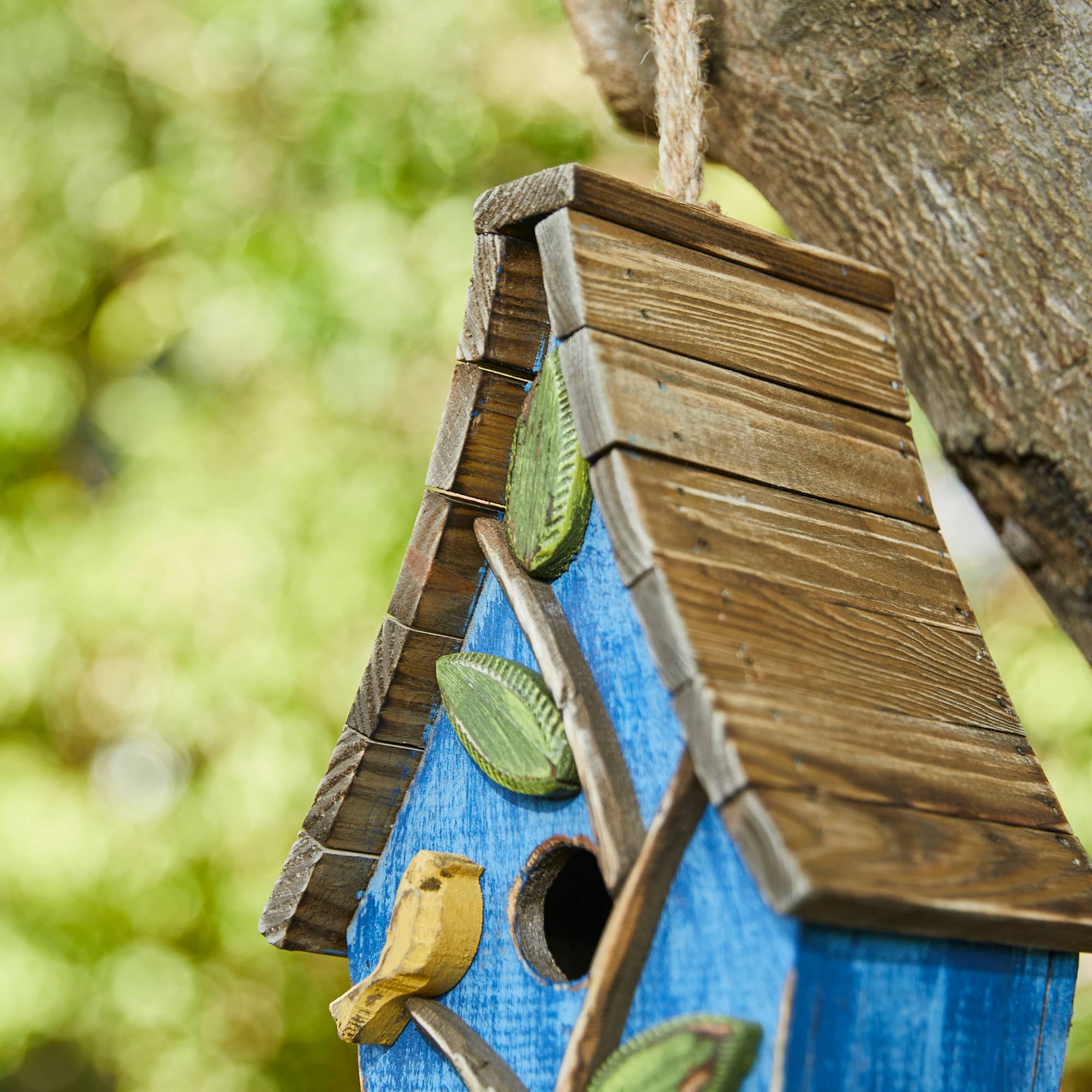 Glitzhome® 12.5" Distressed Wood Birdhouse with Leaves