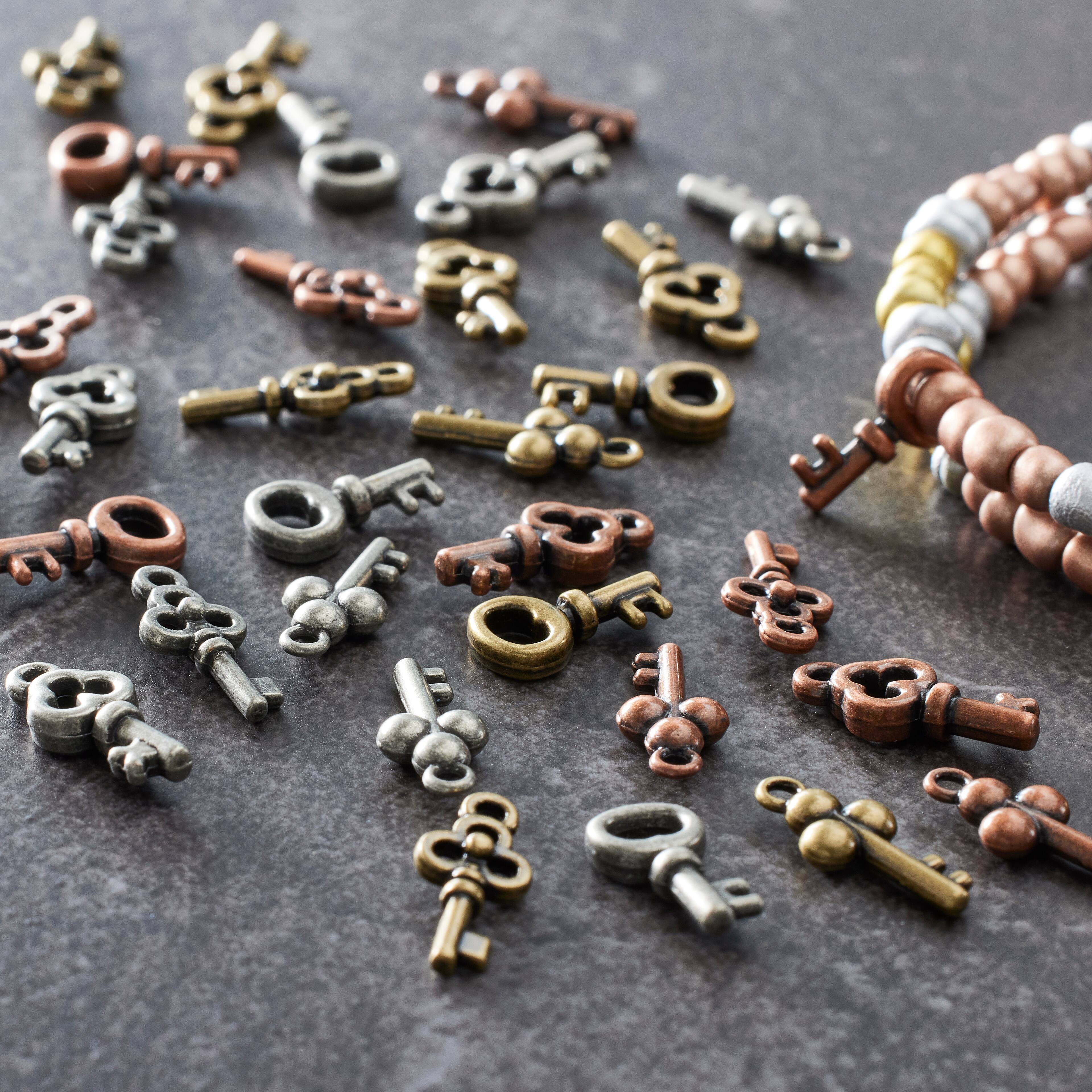 12 Packs: 36 ct. (432 total) Found Objects™ Multicolor Mini Keys by Bead Landing™