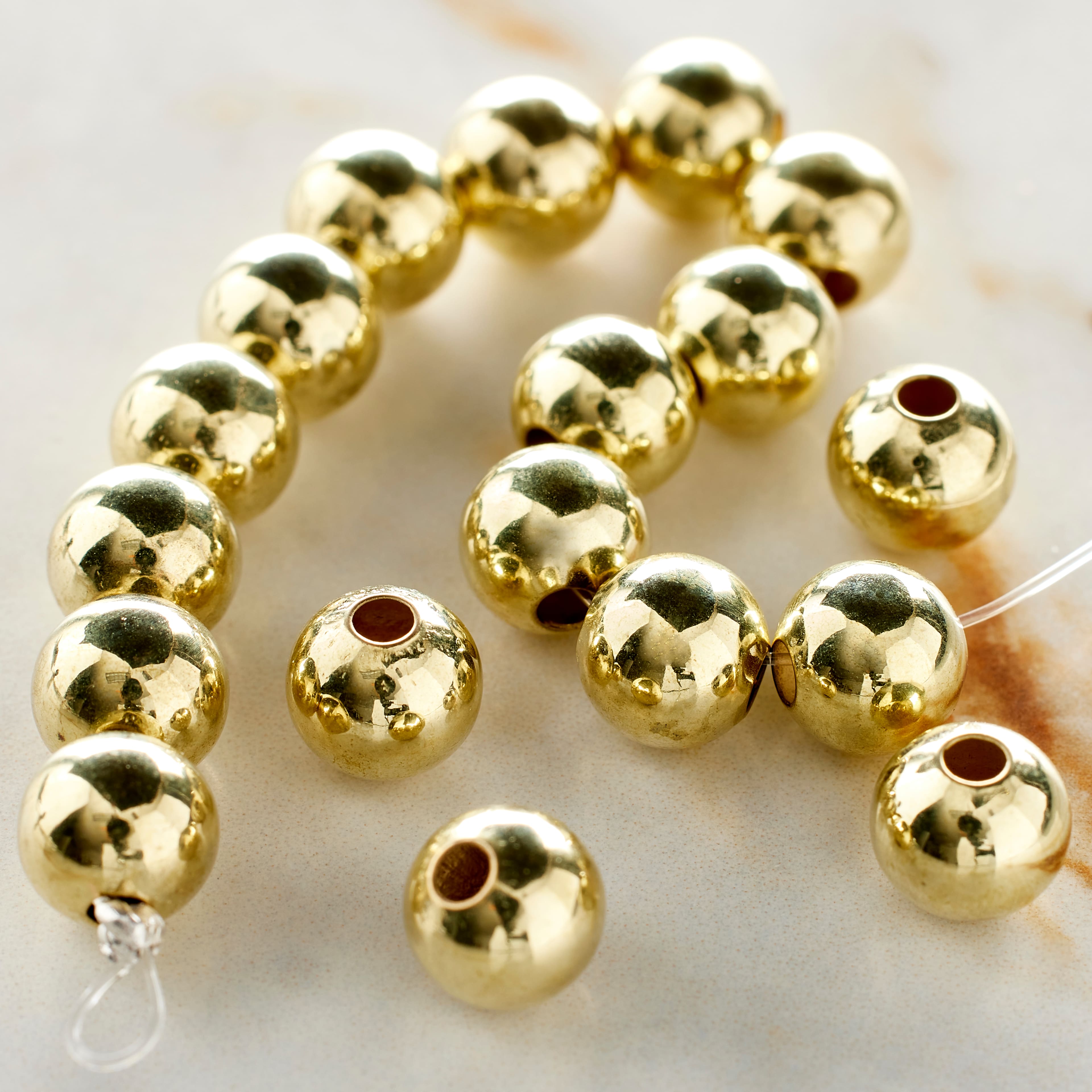 12 Pack: Gold Metal Round Beads, 8mm by Bead Landing&#x2122;