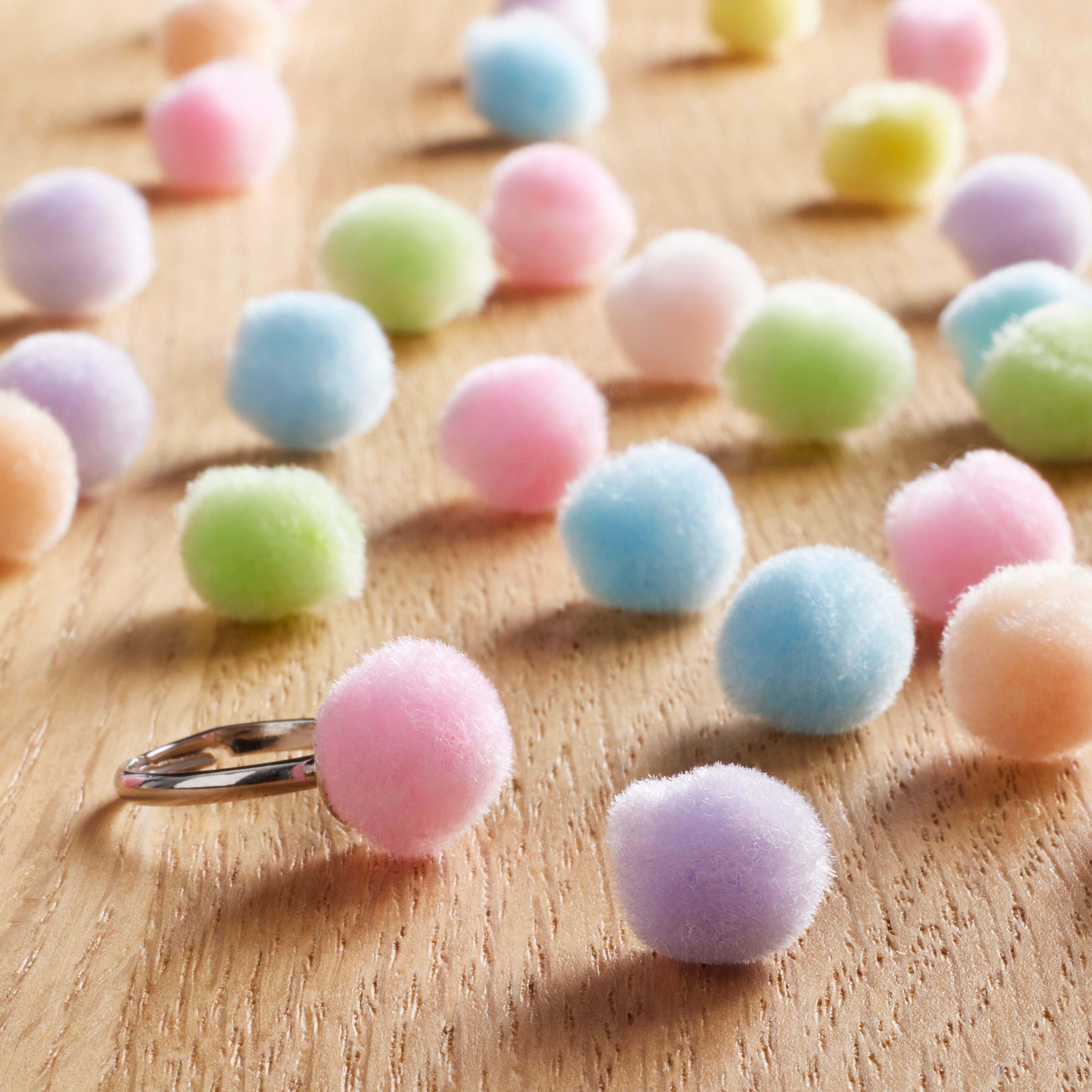 24 Packs: 65 ct. (1,560 total) 1/2&#x22; Pastel Pom Poms by Creatology&#x2122;