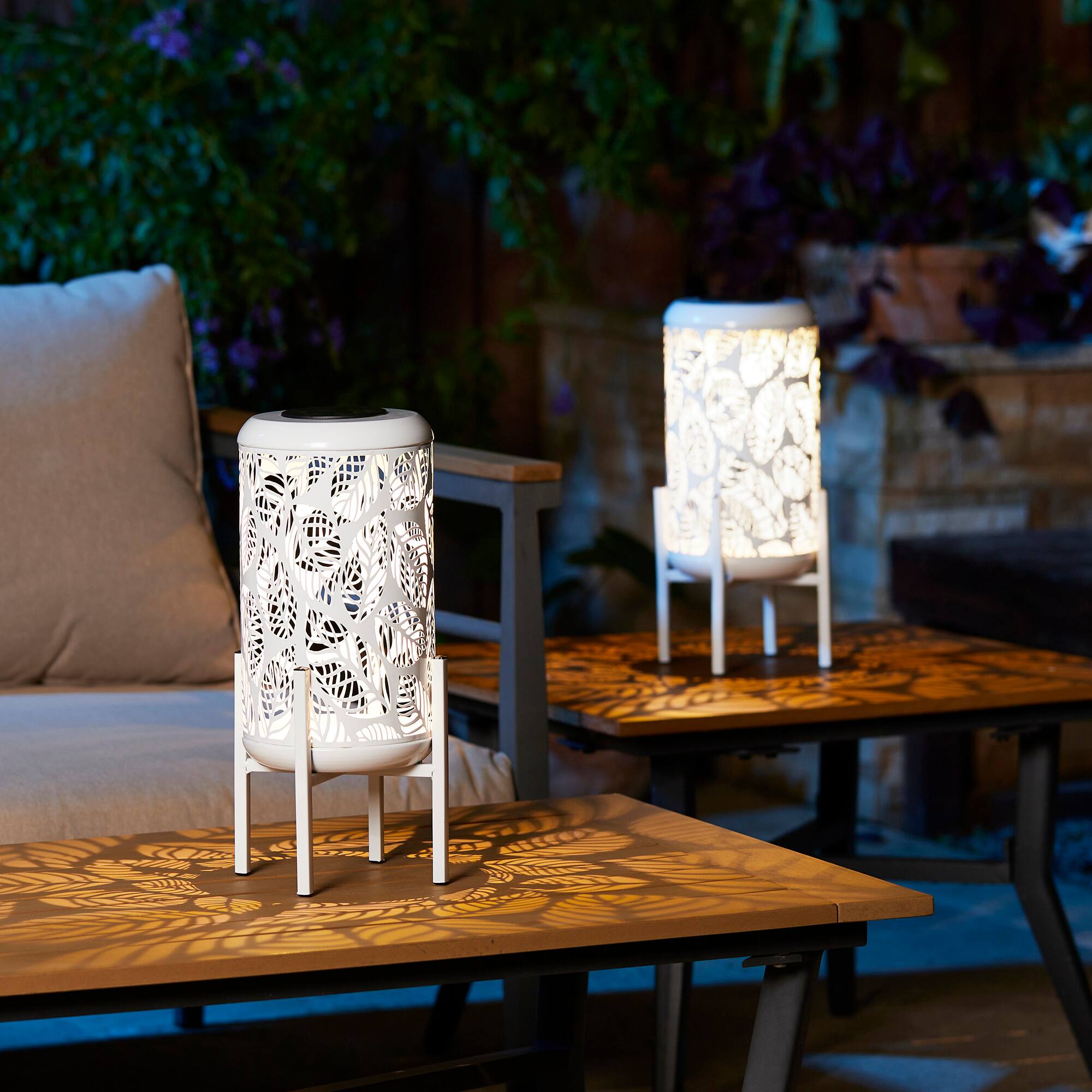 Glitzhome&#xAE; 14.25&#x22; White Metal Cutout Leaves Pattern Solar Powered LED Outdoor Lanterns, 2ct.