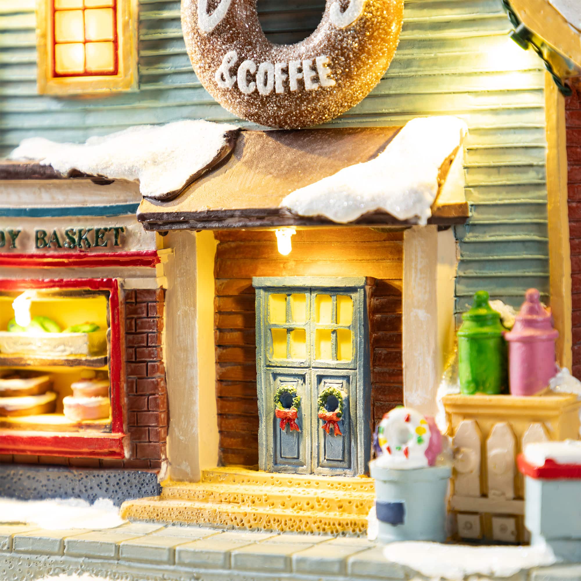 Glitzhome&#xAE; 10.25&#x22; Lighted Christmas Donuts &#x26; Coffee Shop Resin Village with Movement and Music