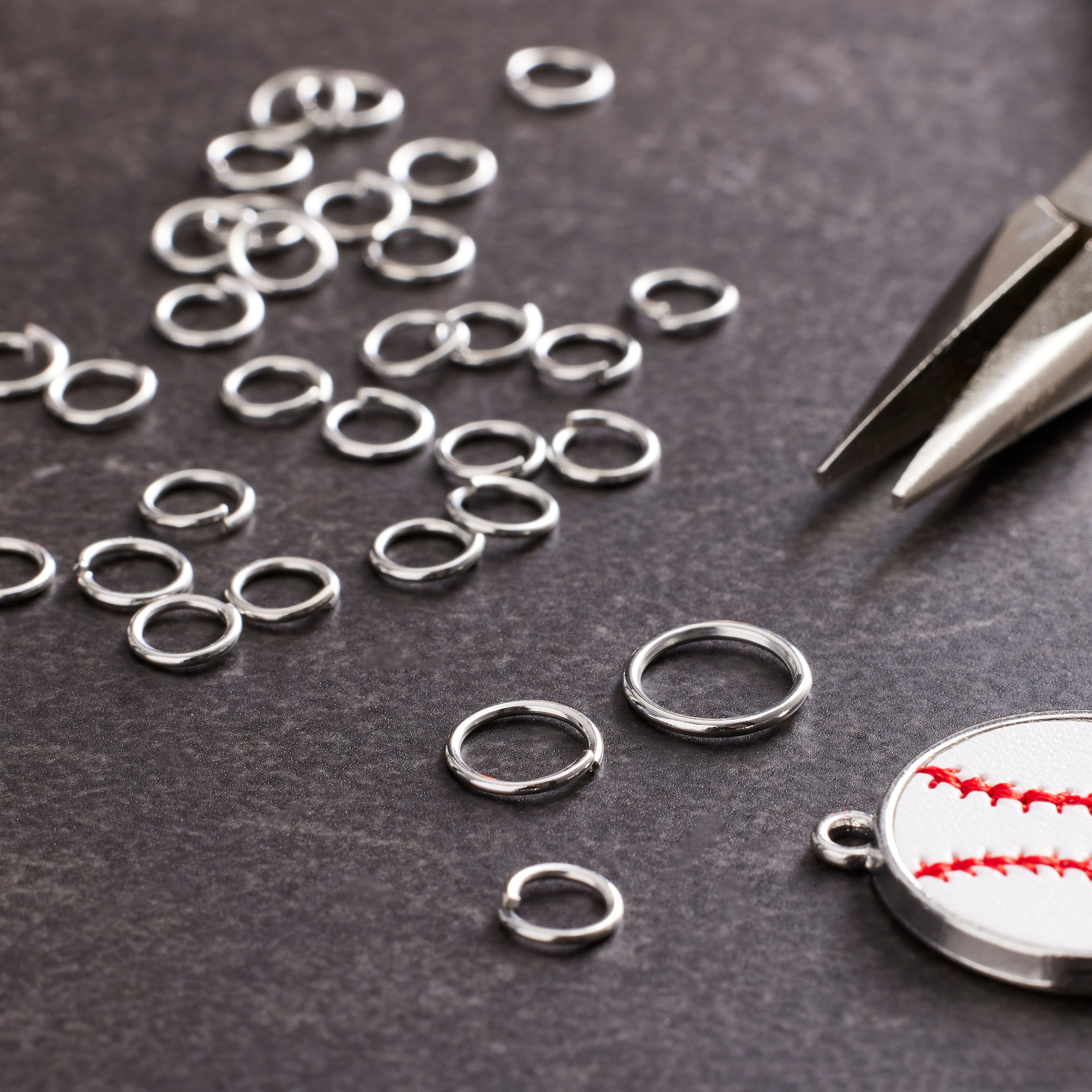 12 Packs: 200 ct. (2,400 total) Rhodium Jump Rings by Creatology™