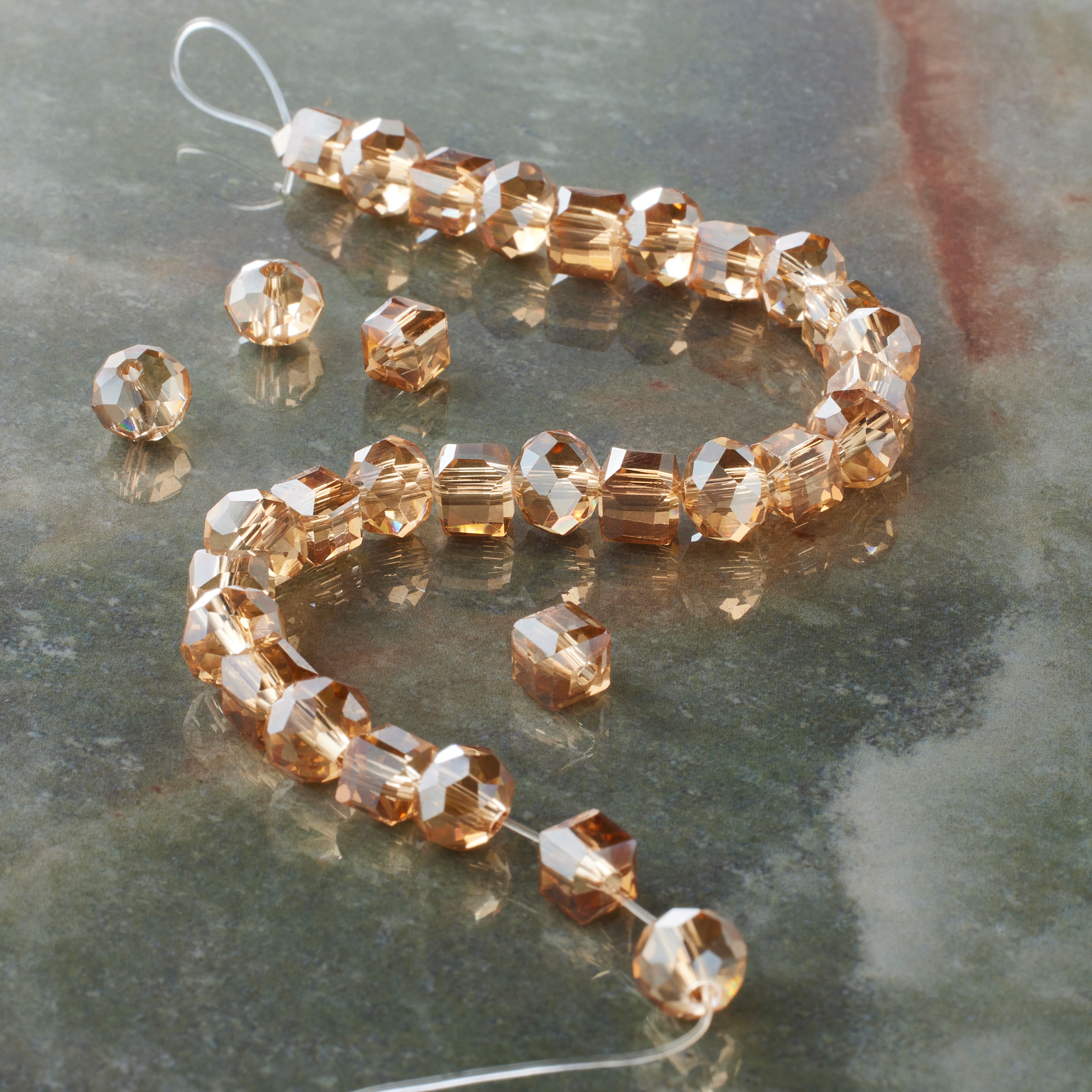 12 Pack: Amber Faceted Glass Cube &#x26; Rondelle Beads, 6mm by Bead Landing&#x2122;