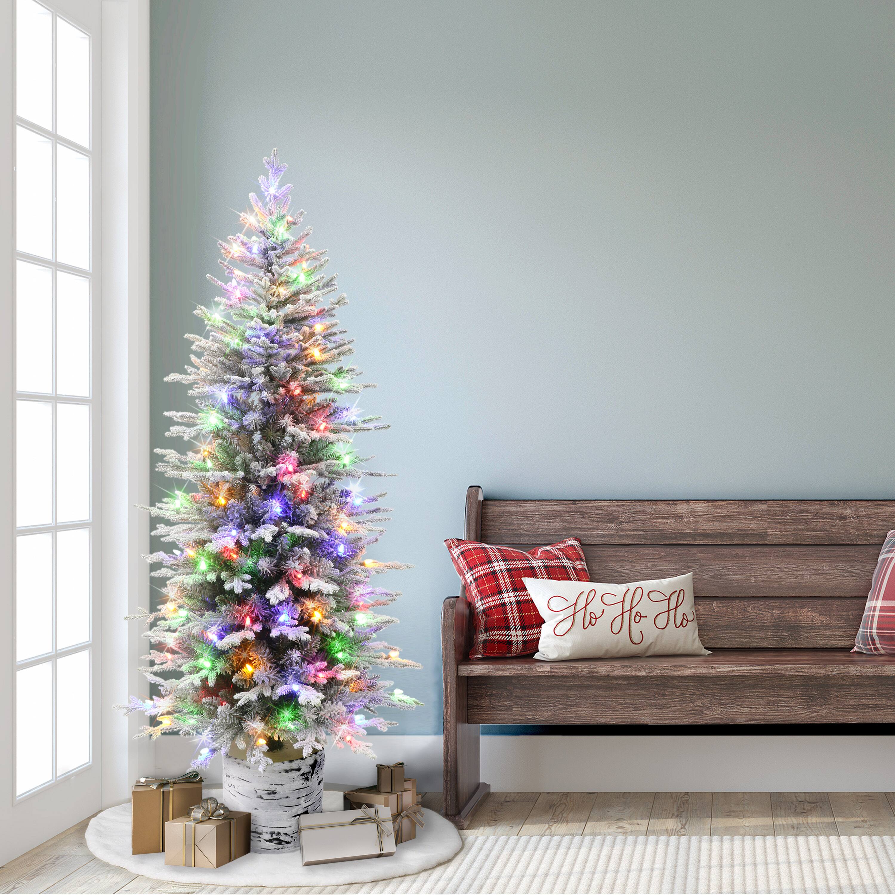 6ft. Pre-Lit Flocked Slim Arctic Fir Artificial Christmas Tree in Stump Planter, Color Select LED Lights