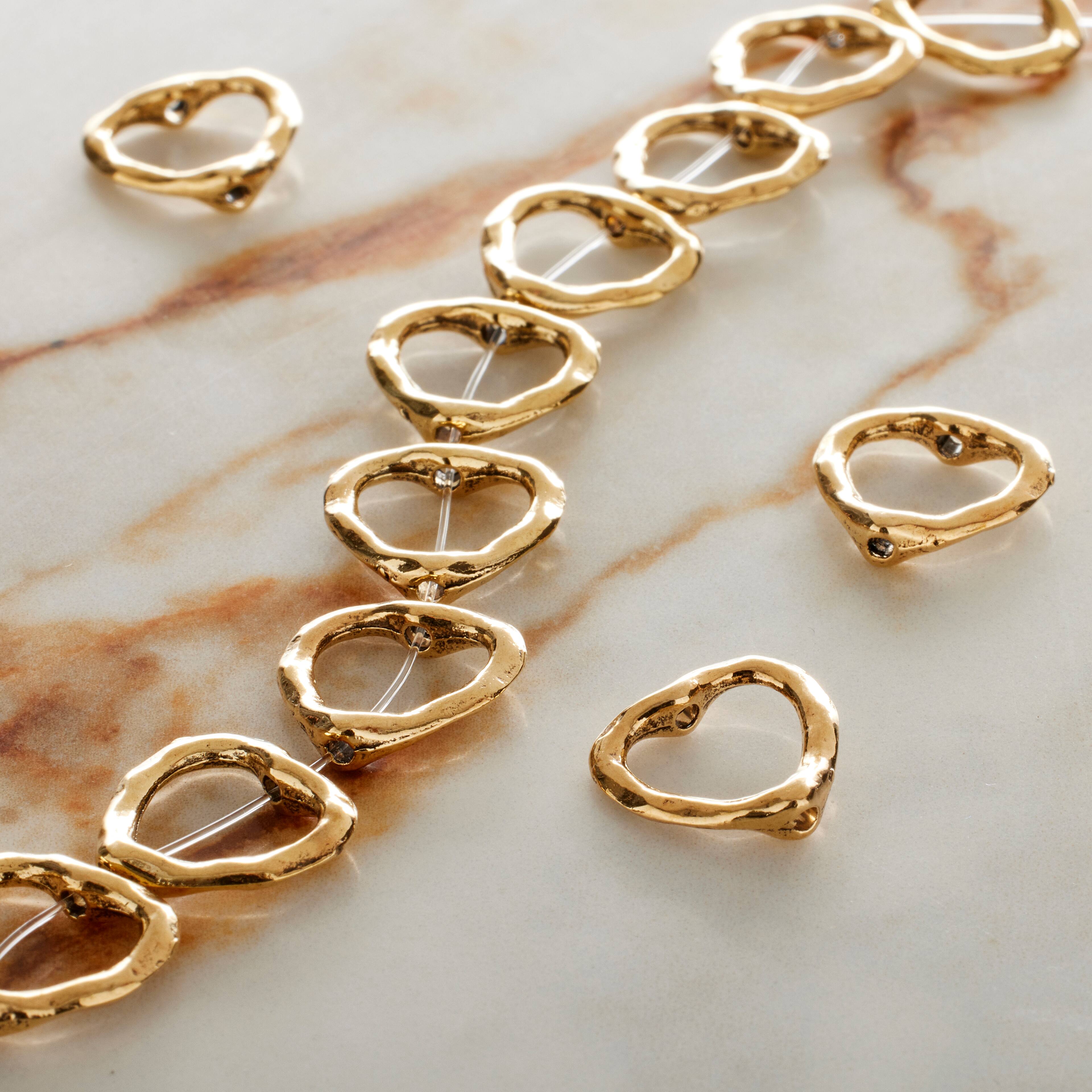 12 Packs: 12 ct. (144 total) Gold Metal Heart Beads, 13mm by Bead Landing™