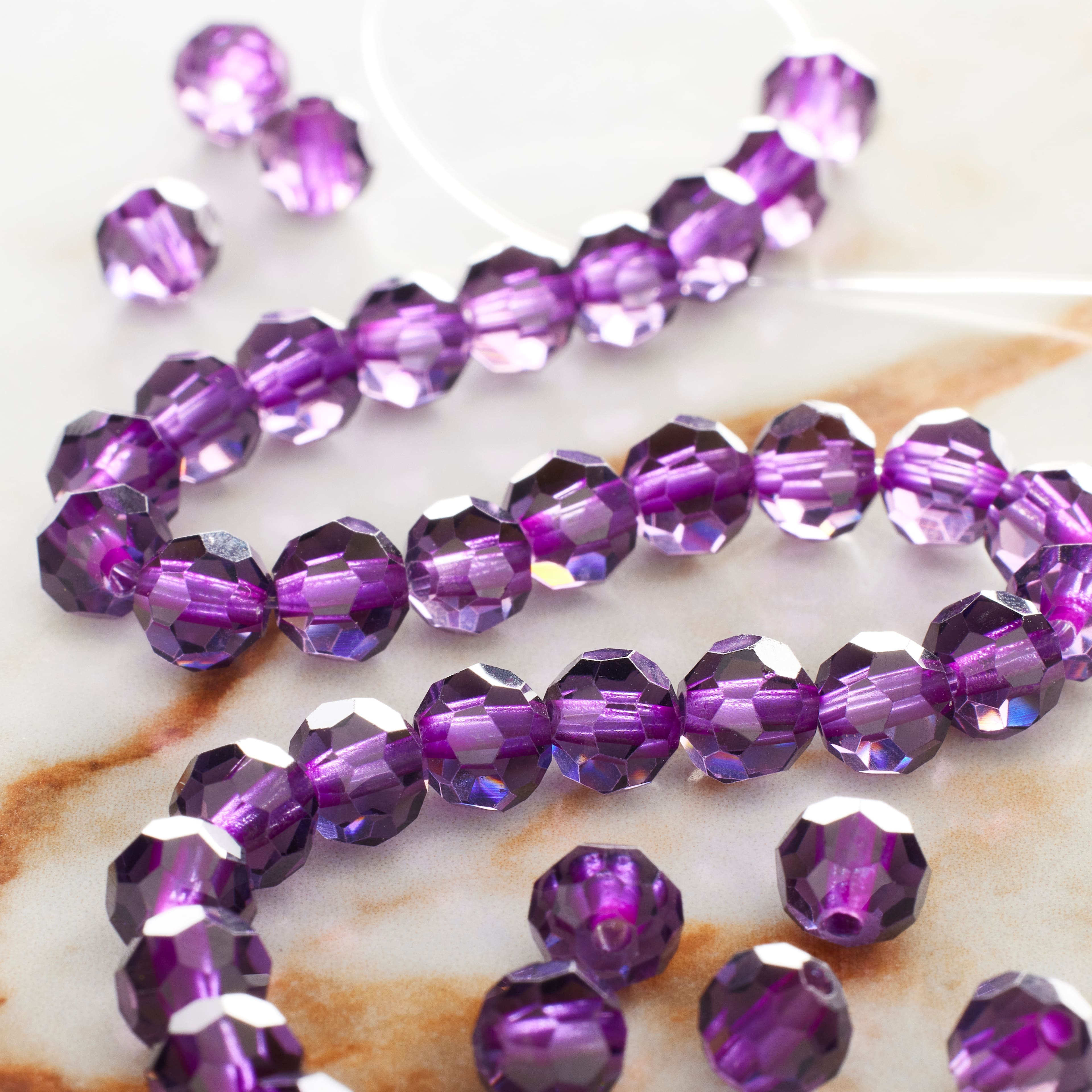 12 Pack: Purple Glass Faceted Round Beads, 6mm by Bead Landing™