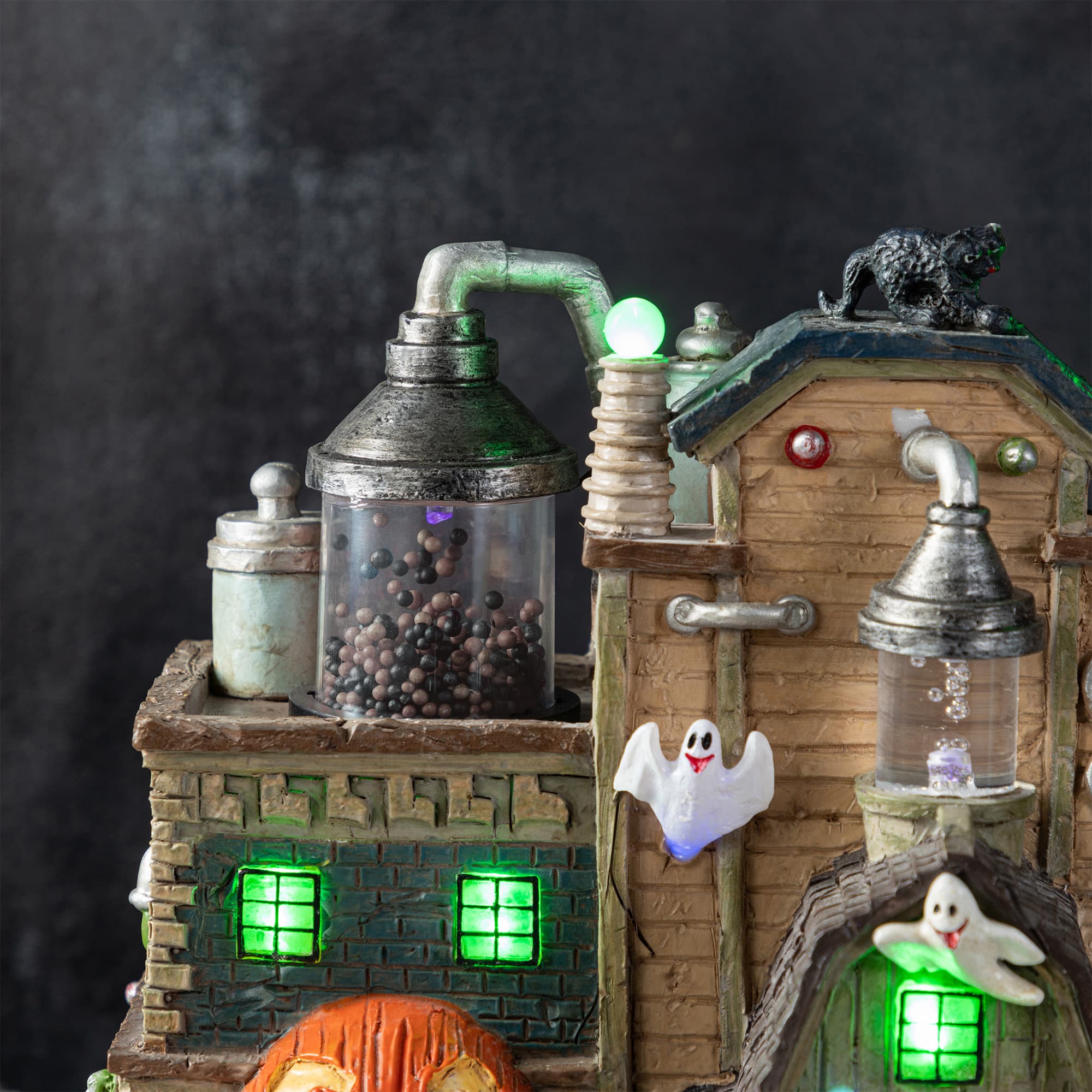 Glitzhome® 11"H Lighted Resin Halloween Haunted House Village