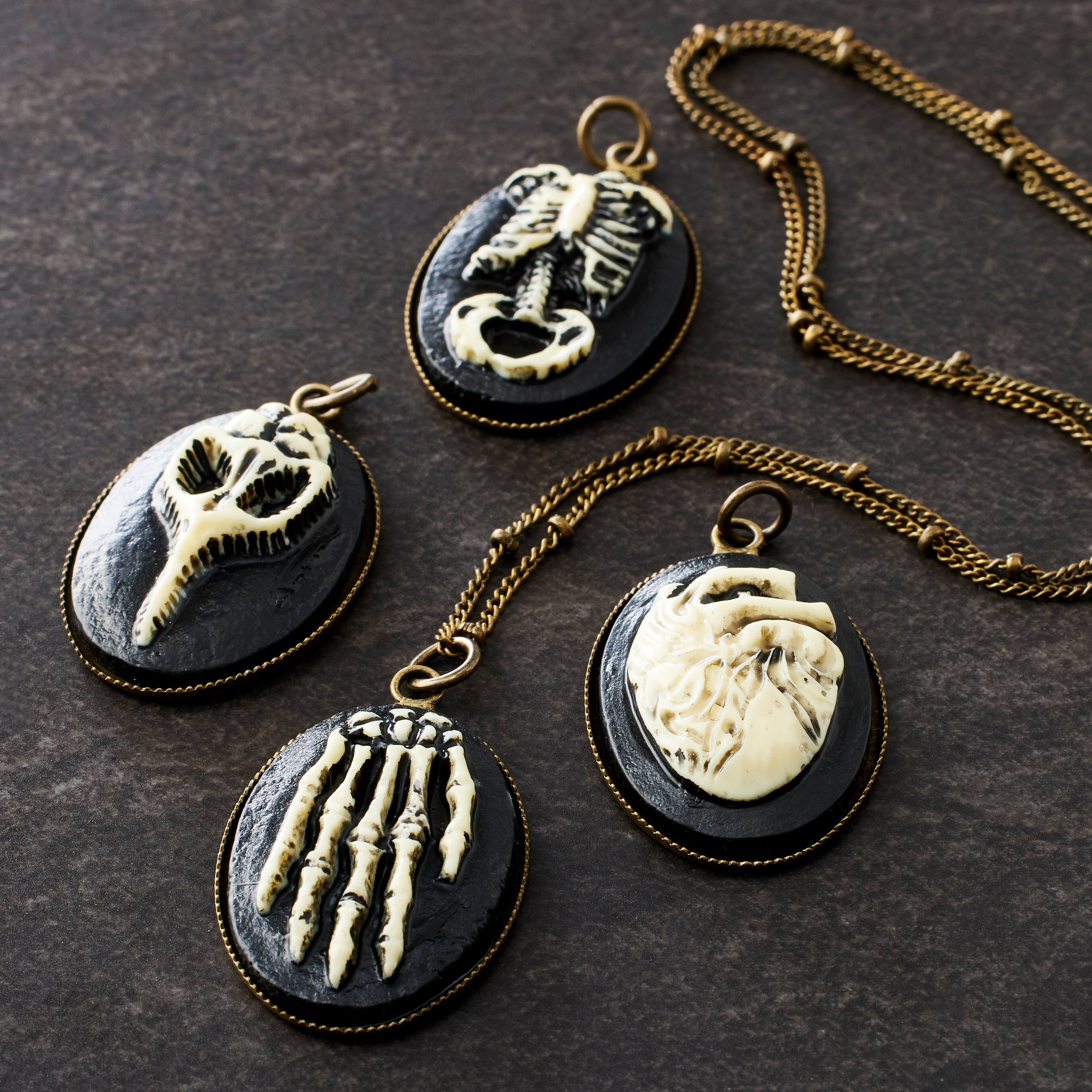 12 Packs: 4 ct. (48 total) Found Objects™ Anatomy Resin Charms by Bead Landing™