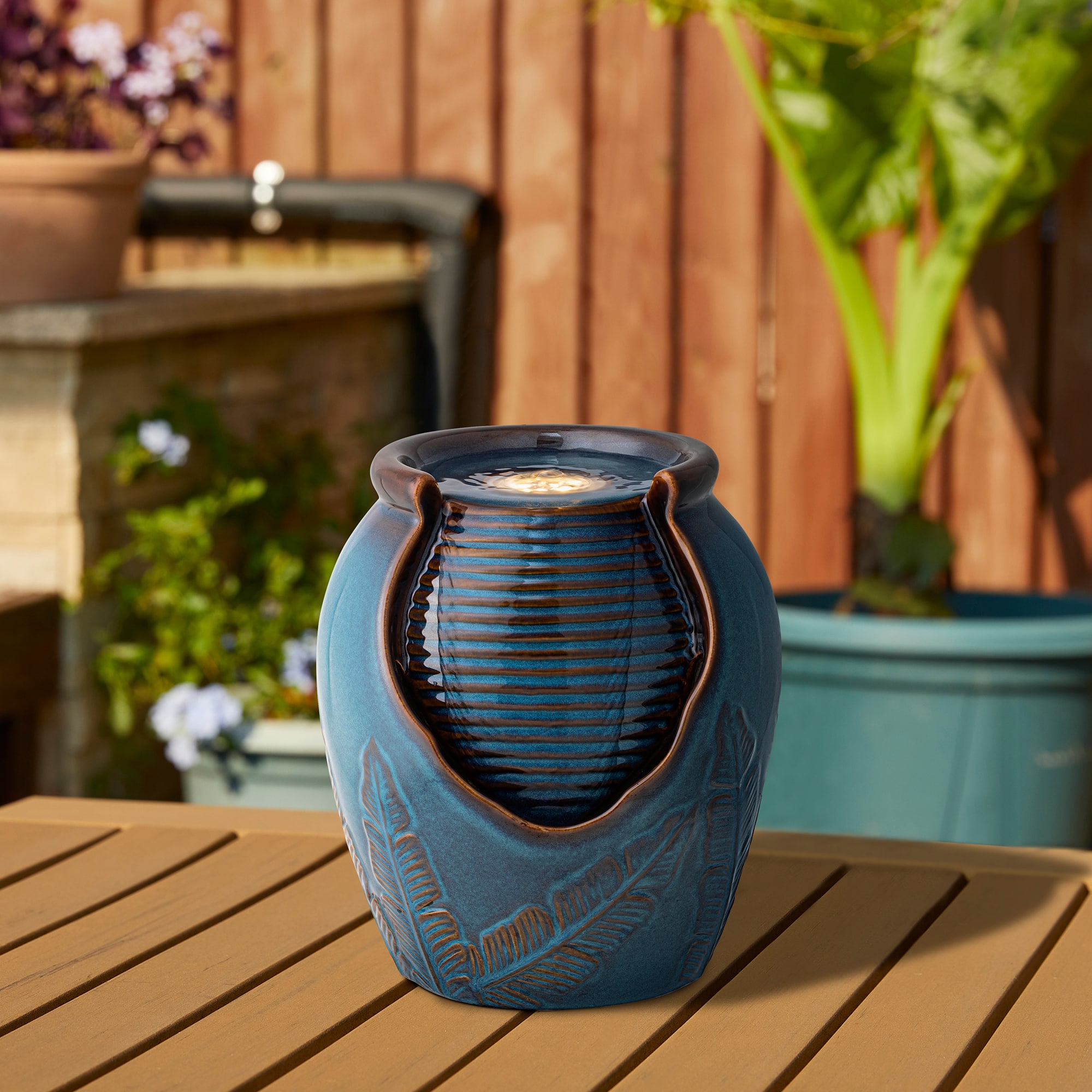 Glitzhome&#xAE; 9.25&#x22; LED Turquoise Leaf Textured Ceramic Jar Tabletop Fountain