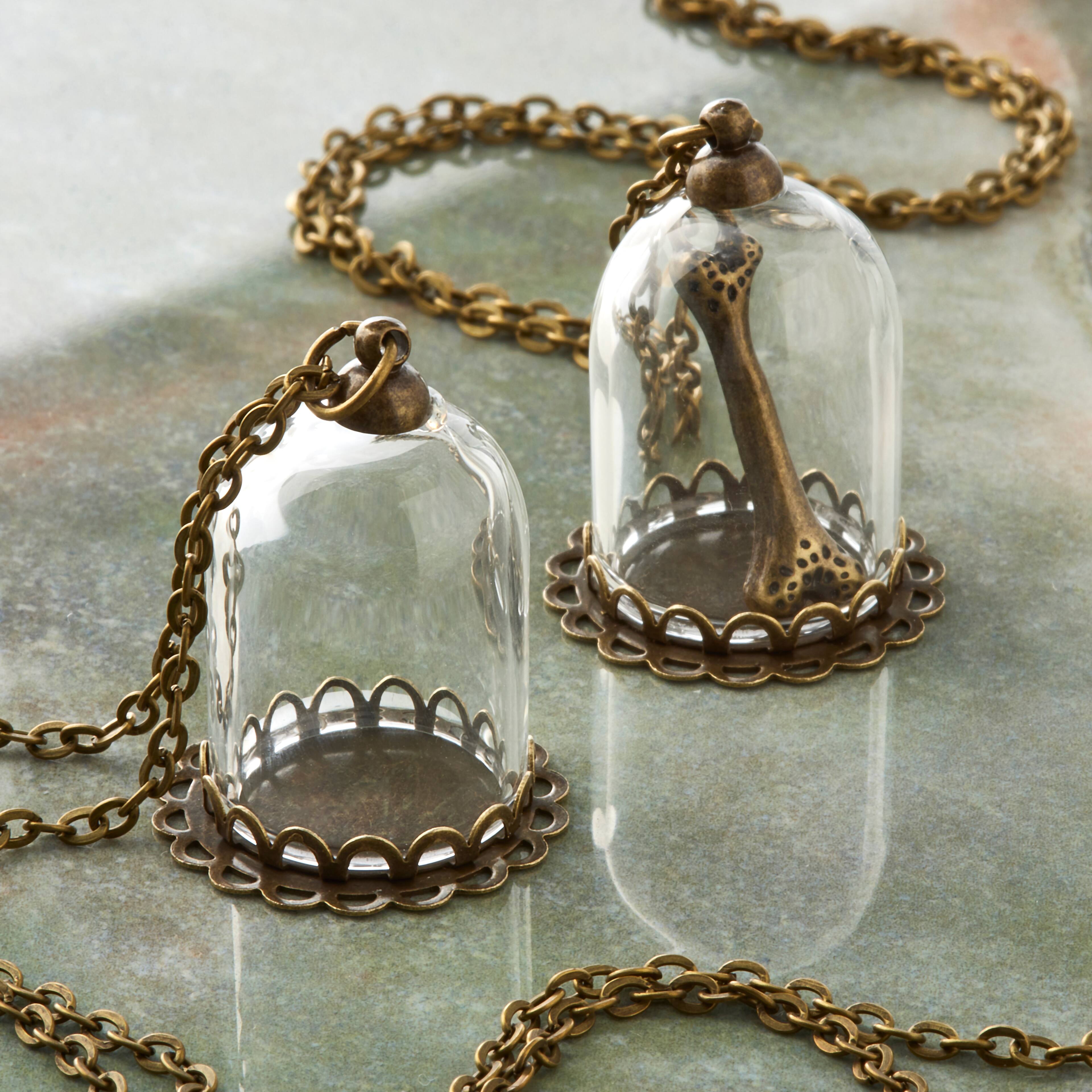 12 Packs: 2ct. (24 total) Found Objects™ Oxidized Brass Small Bottle Charms by Bead Landing™