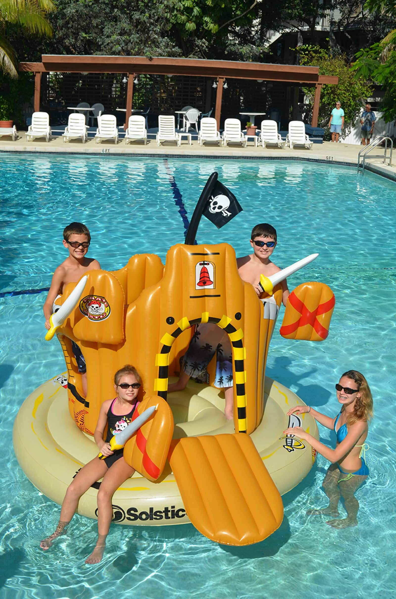 Swim Central 6.8ft. Inflatable Orange Pirate Castle Adventure Swimming Float