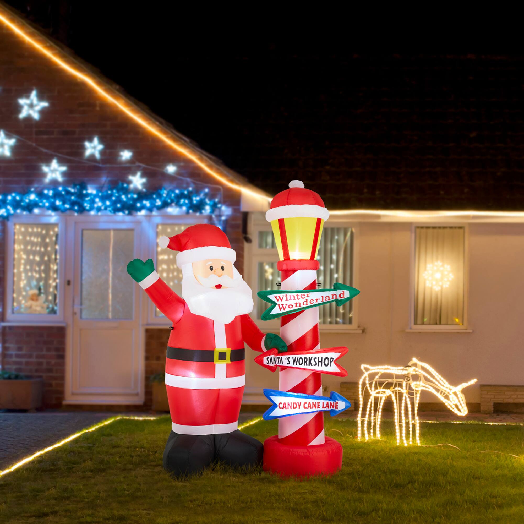 Glitzhome&#xAE; 7FT Lighted Inflatable Santa with Lamp Post Sign Decor
