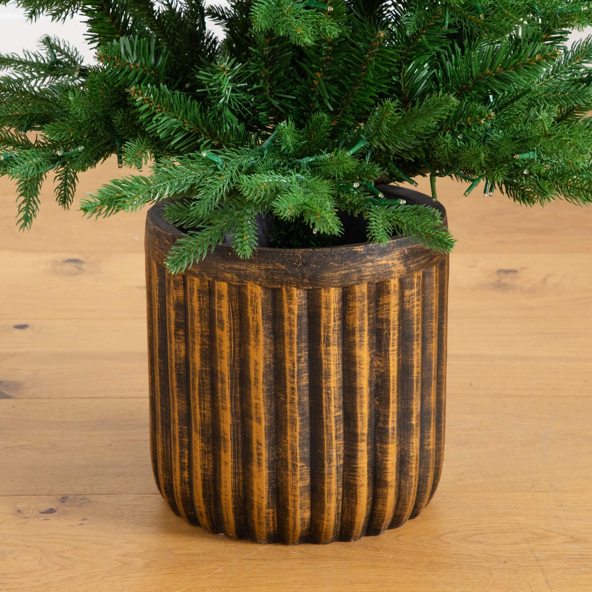 4.5ft. Pre-Lit Pine Artificial Christmas Tree in Decorative Planter with Clear LED Lights