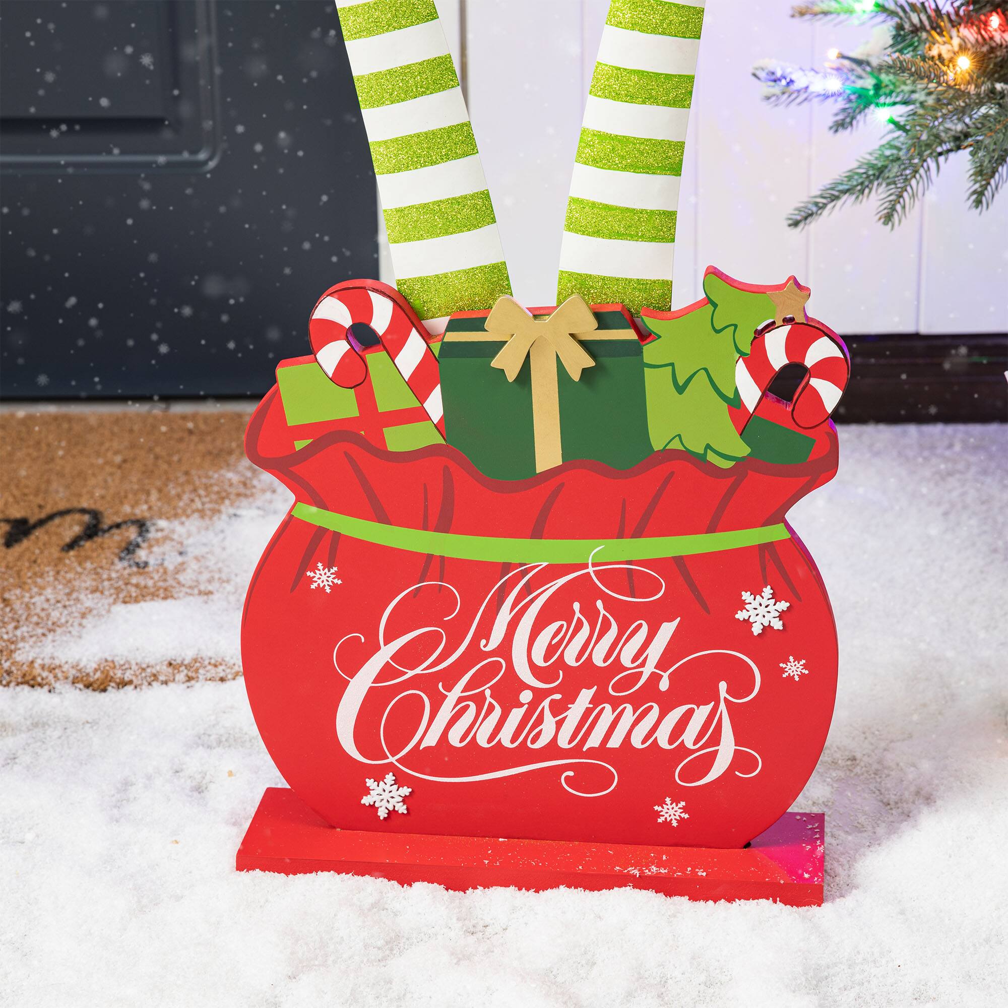 Glitzhome® 2ft. Wood & Metal Elf Legs in Gift Box Porch Décor