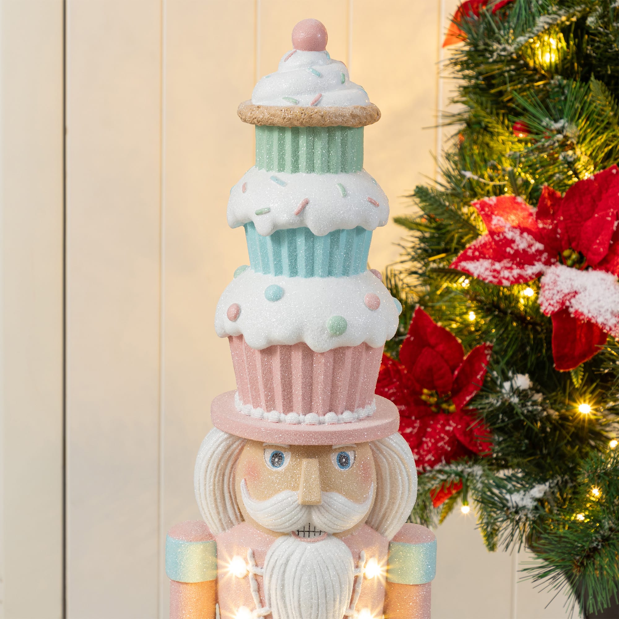 Glitzhome&#xAE; 28&#x22; Lighted Resin Christmas Cupcake Nutcracker Porch Decor with Timer