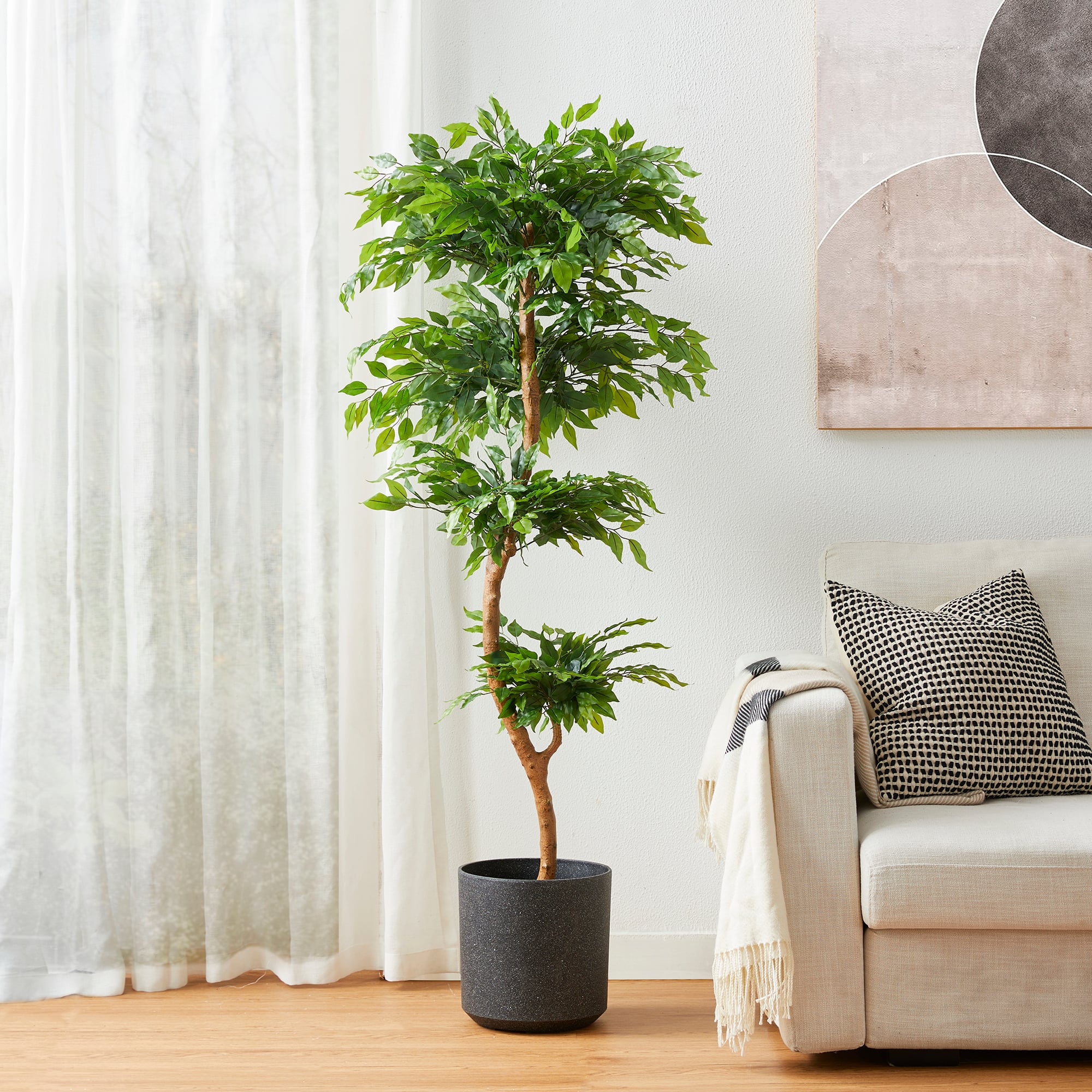Glitzhome&#xAE; 5ft. Creative Shaped Faux Ficus Tree in Pot