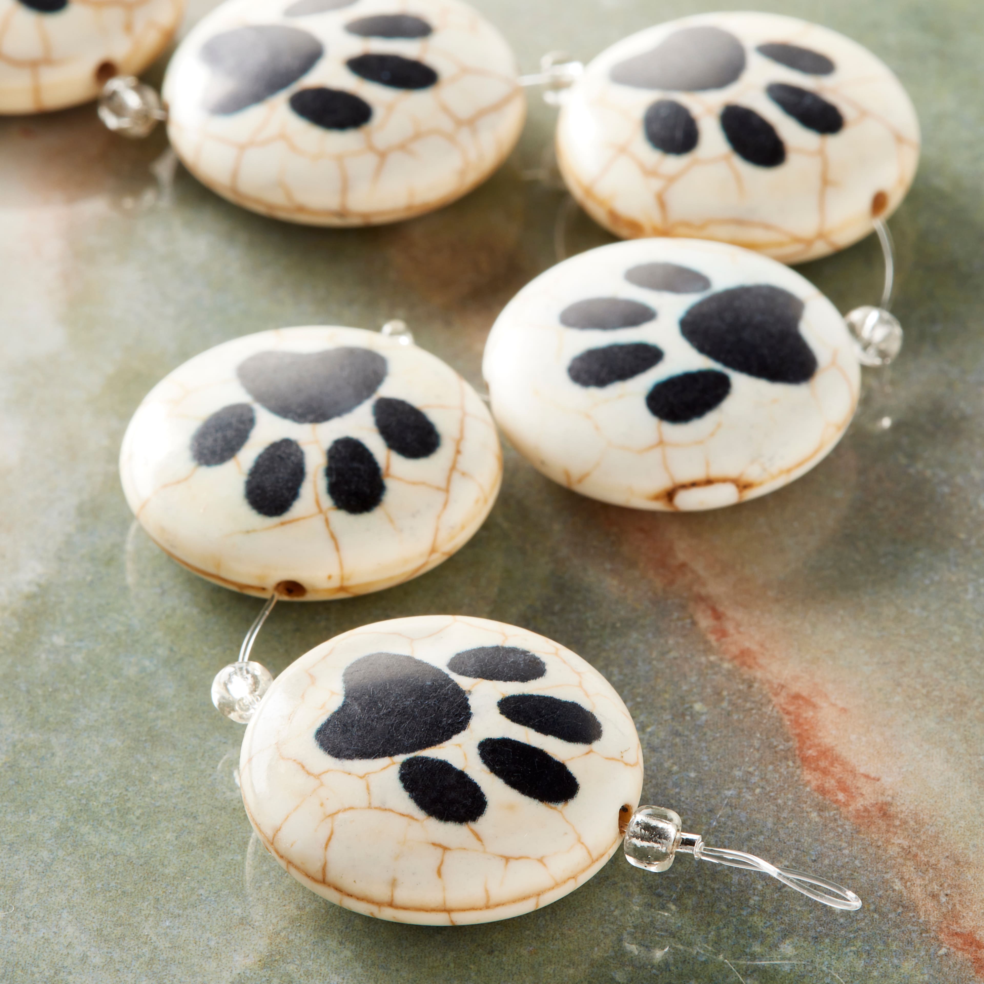 9 Packs: 6 ct. (54 total) Paw Print Reconstituted Quartzite Lentil Beads, 24mm by Bead Landing™