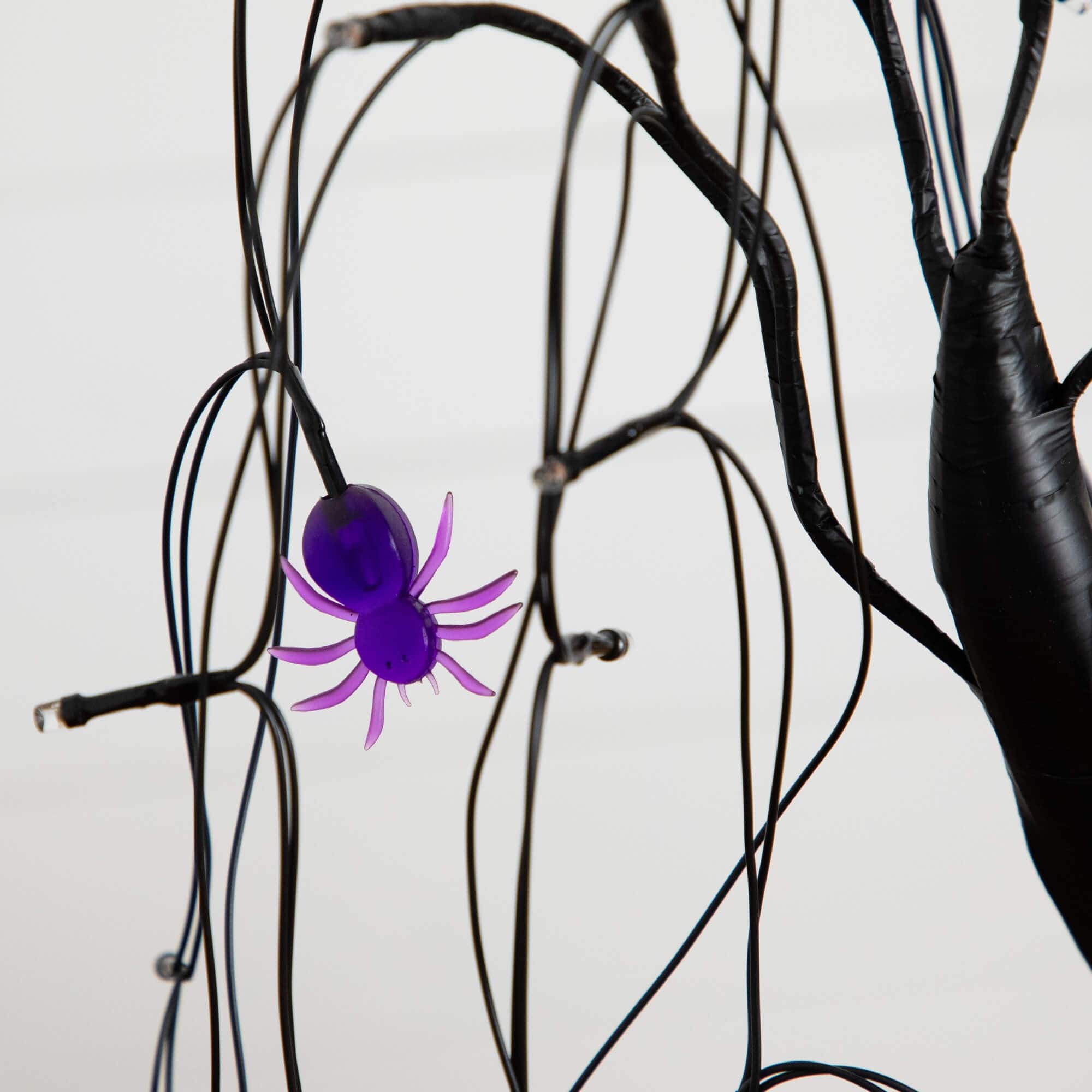 2ft. Pre-Lit Halloween Artificial Black Spooky Spider Willow Tree with 60 Orange &#x26; Purple LED Lights