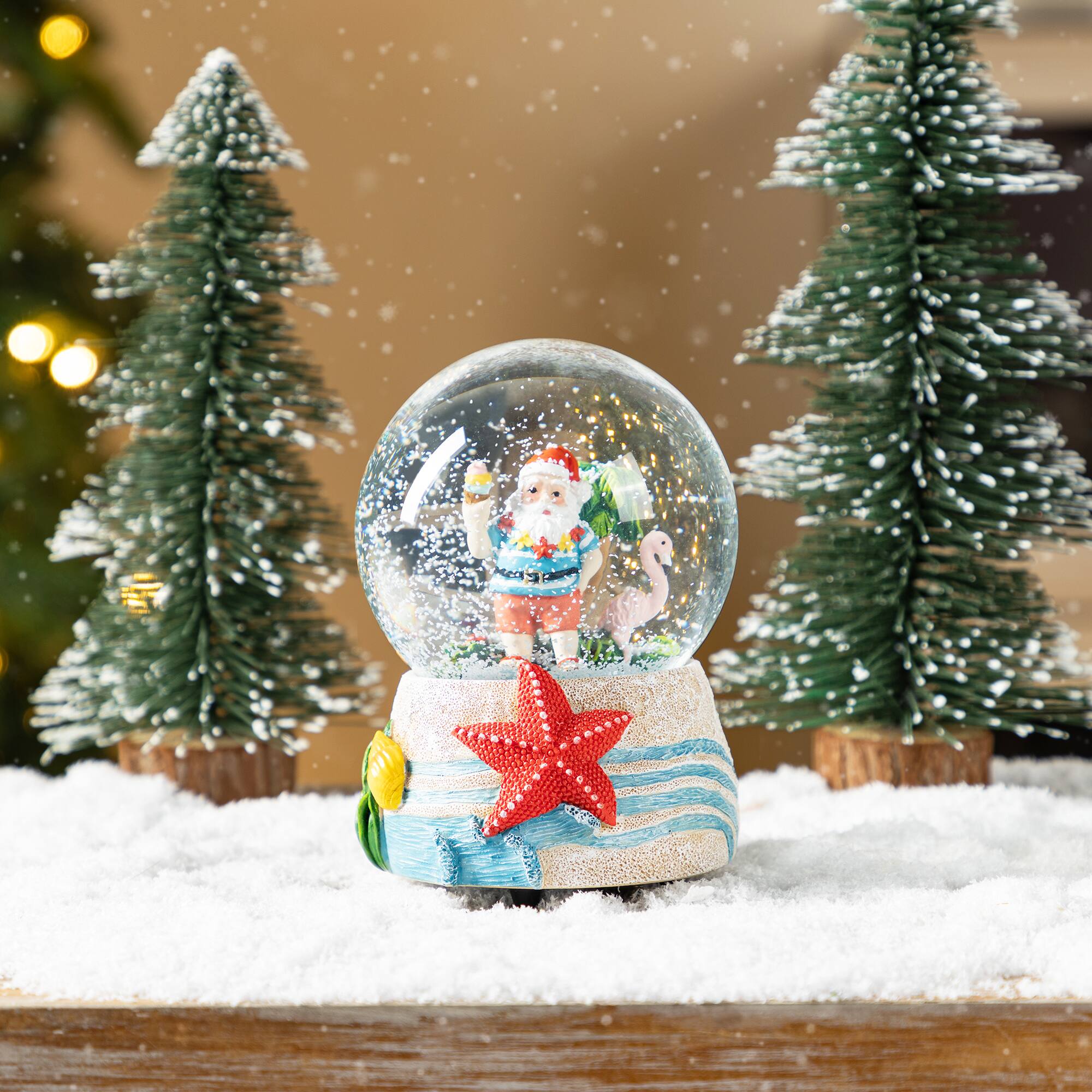 Glitzhome&#xAE; 100mm Christmas Resin Musical Snowflakes Santa on Vacation Waterglobe