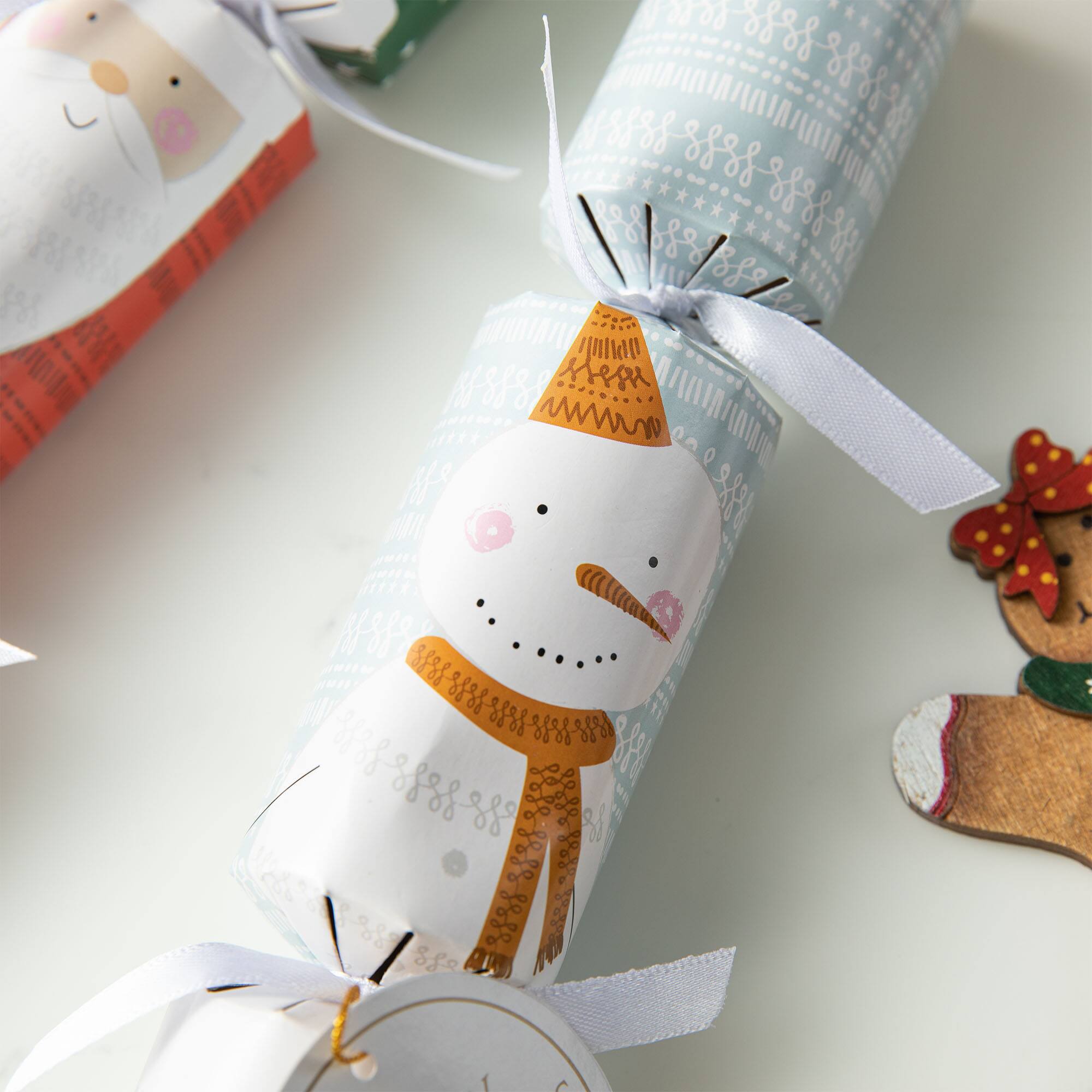 Glitzhome® 10" Christmas Santa & Snowman Party Cracker with Gift Contents, 8ct.