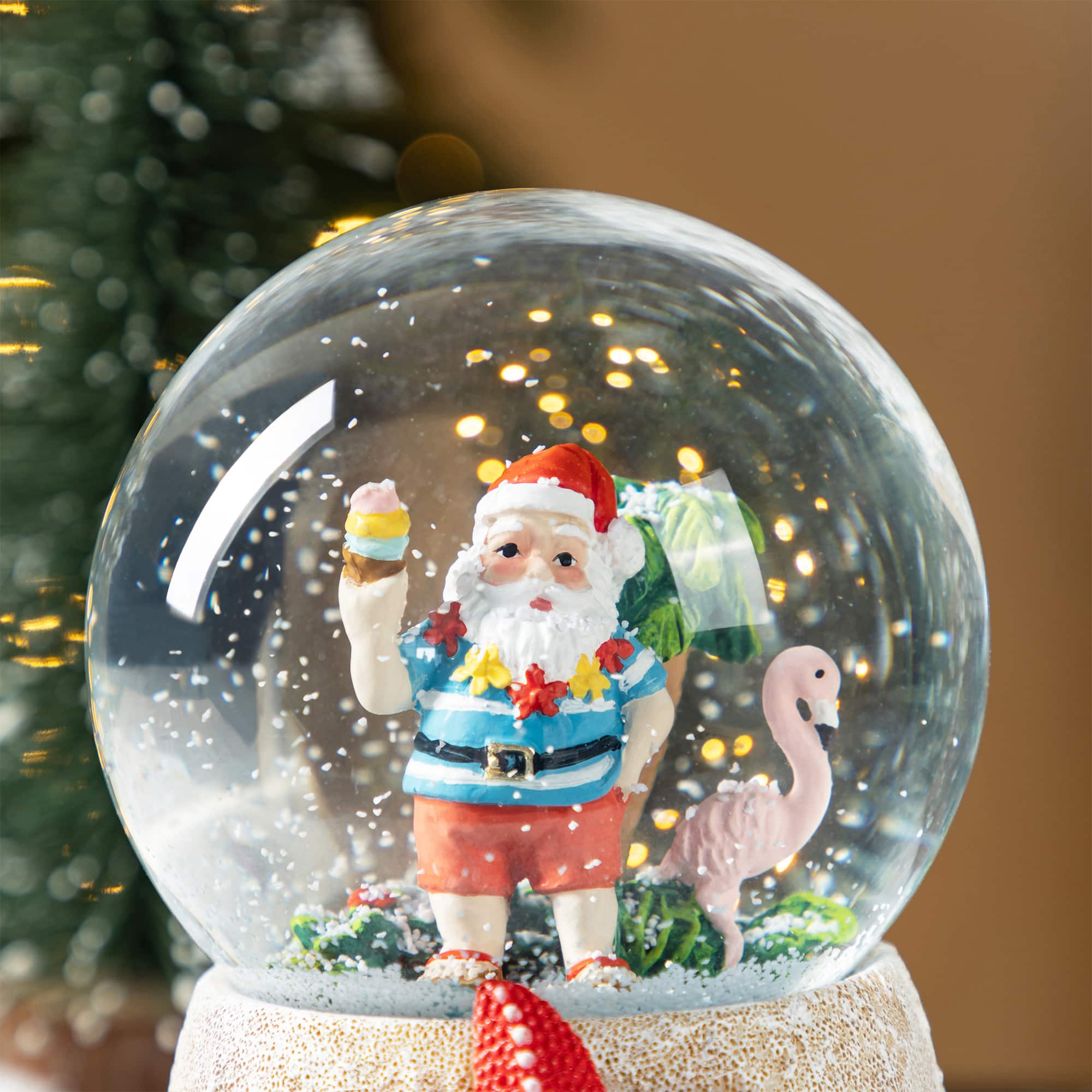 Glitzhome&#xAE; 100mm Christmas Resin Musical Snowflakes Santa on Vacation Waterglobe
