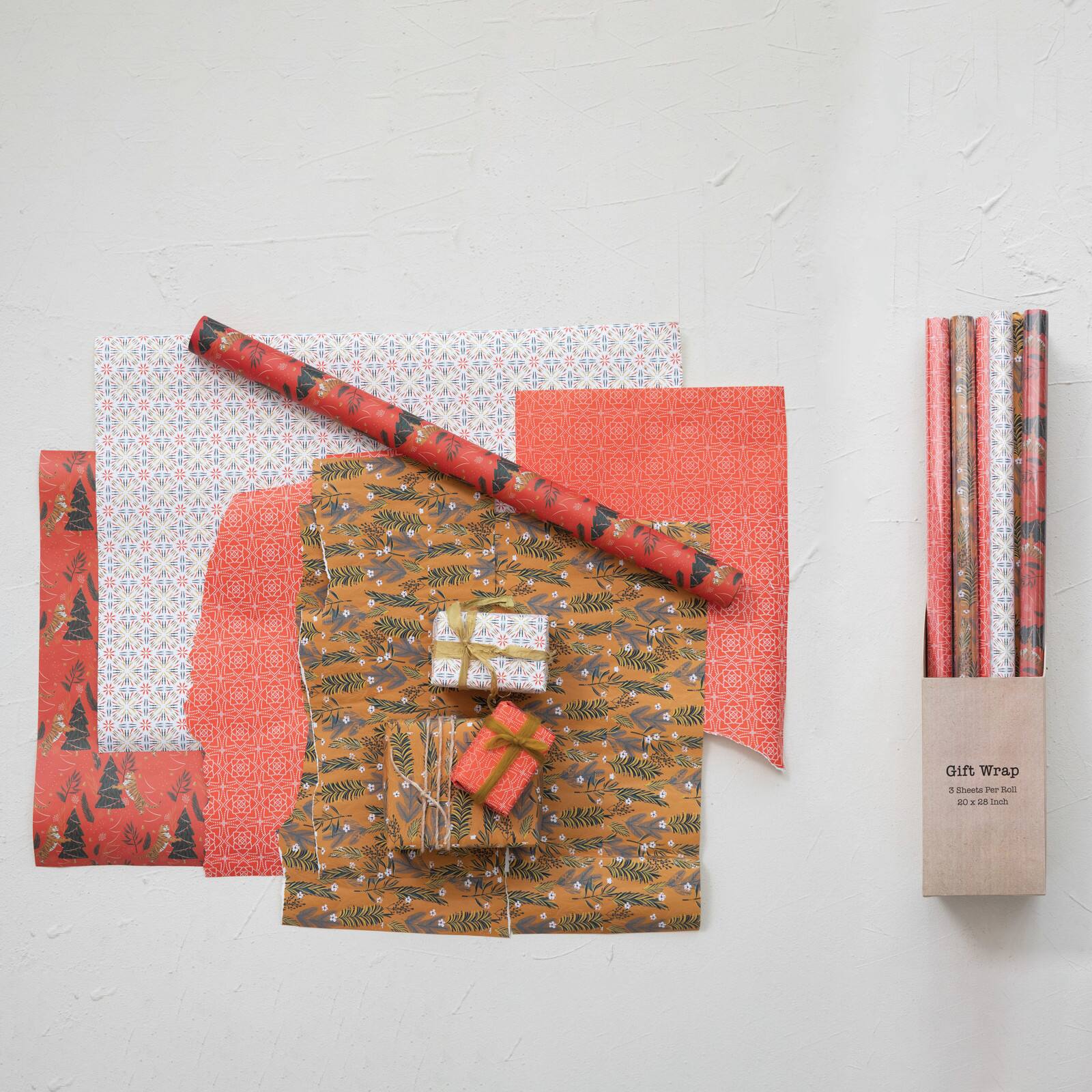 Hello Honey® 28" Wrapping Paper Sheets with Various Holiday Patterns, 12ct.