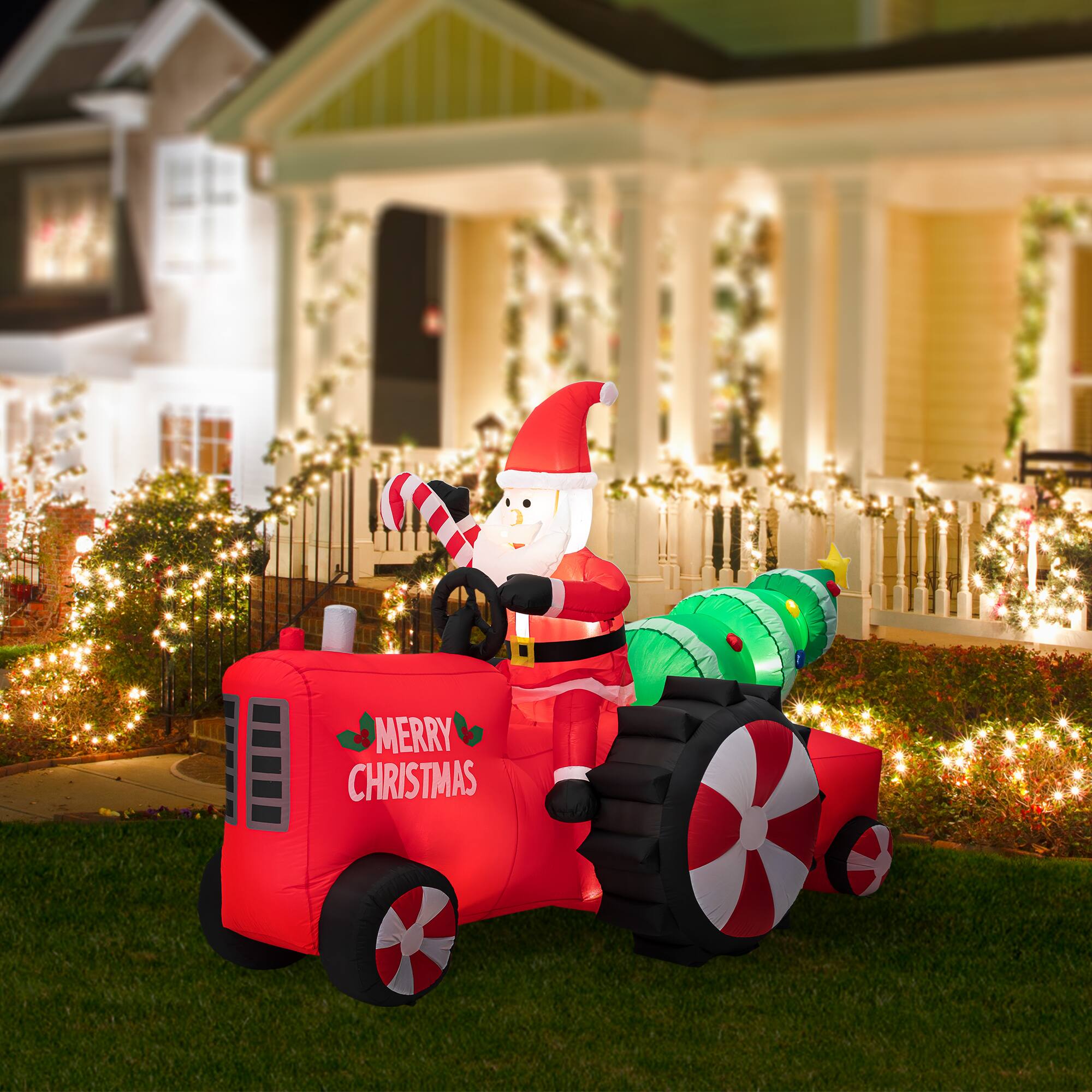 Glitzhome® 11ft. Lighted Inflatable Santa on Tractor Décor