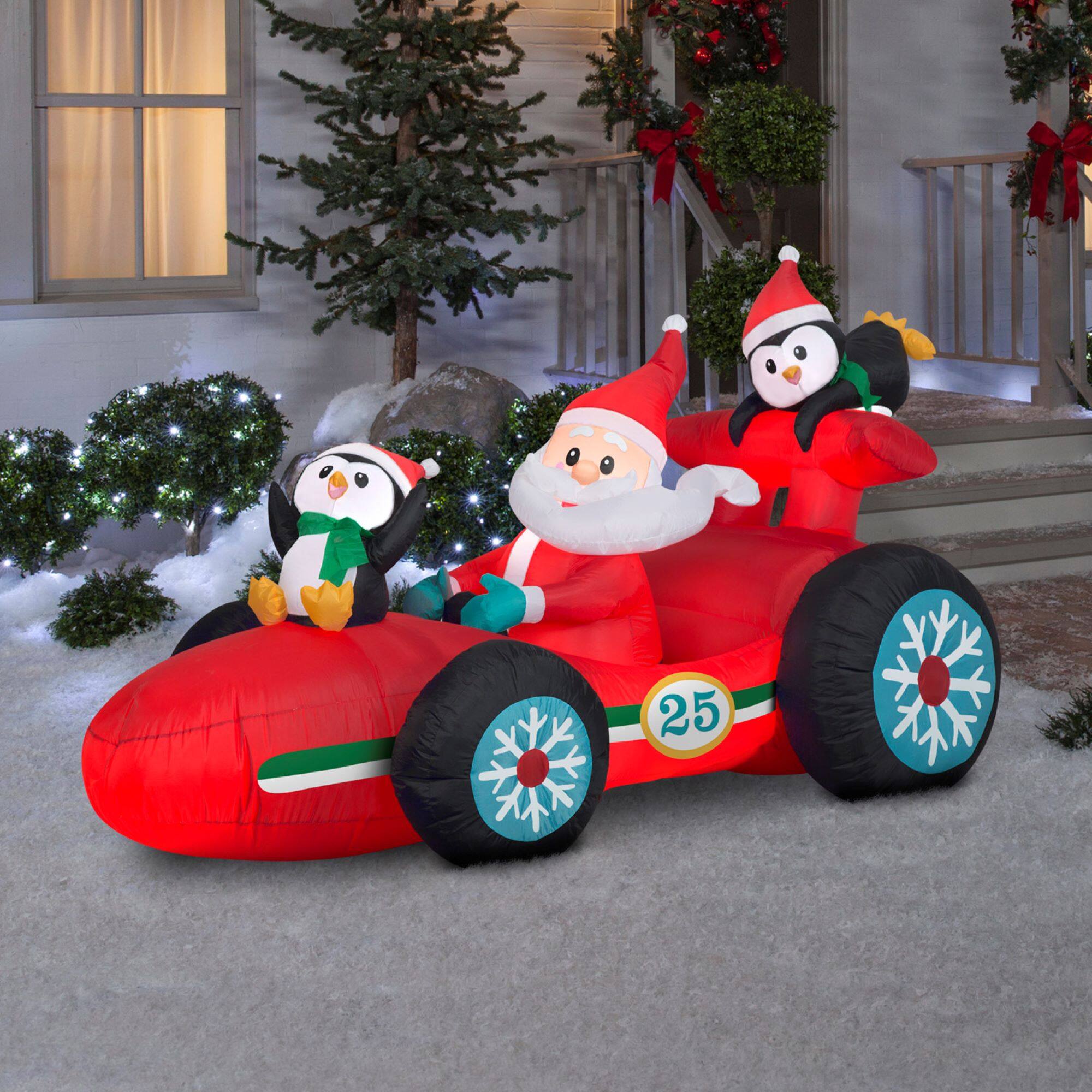 7.5ft. Airblown® Inflatable Santa in Racecar with Penguins