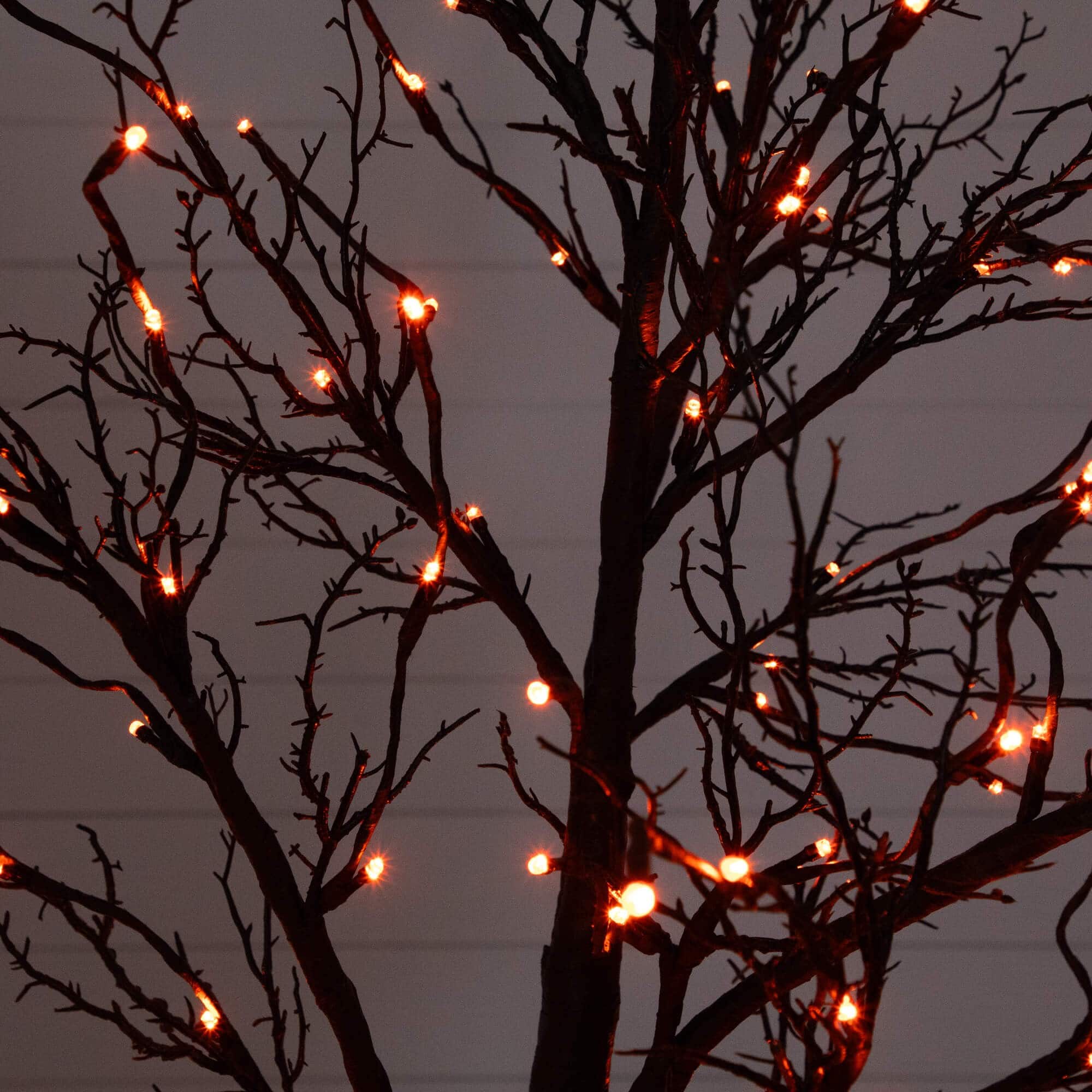 7ft. Pre-Lit Halloween Deluxe Black Twig Artificial Tree with 180 Orange & Purple LED Lights