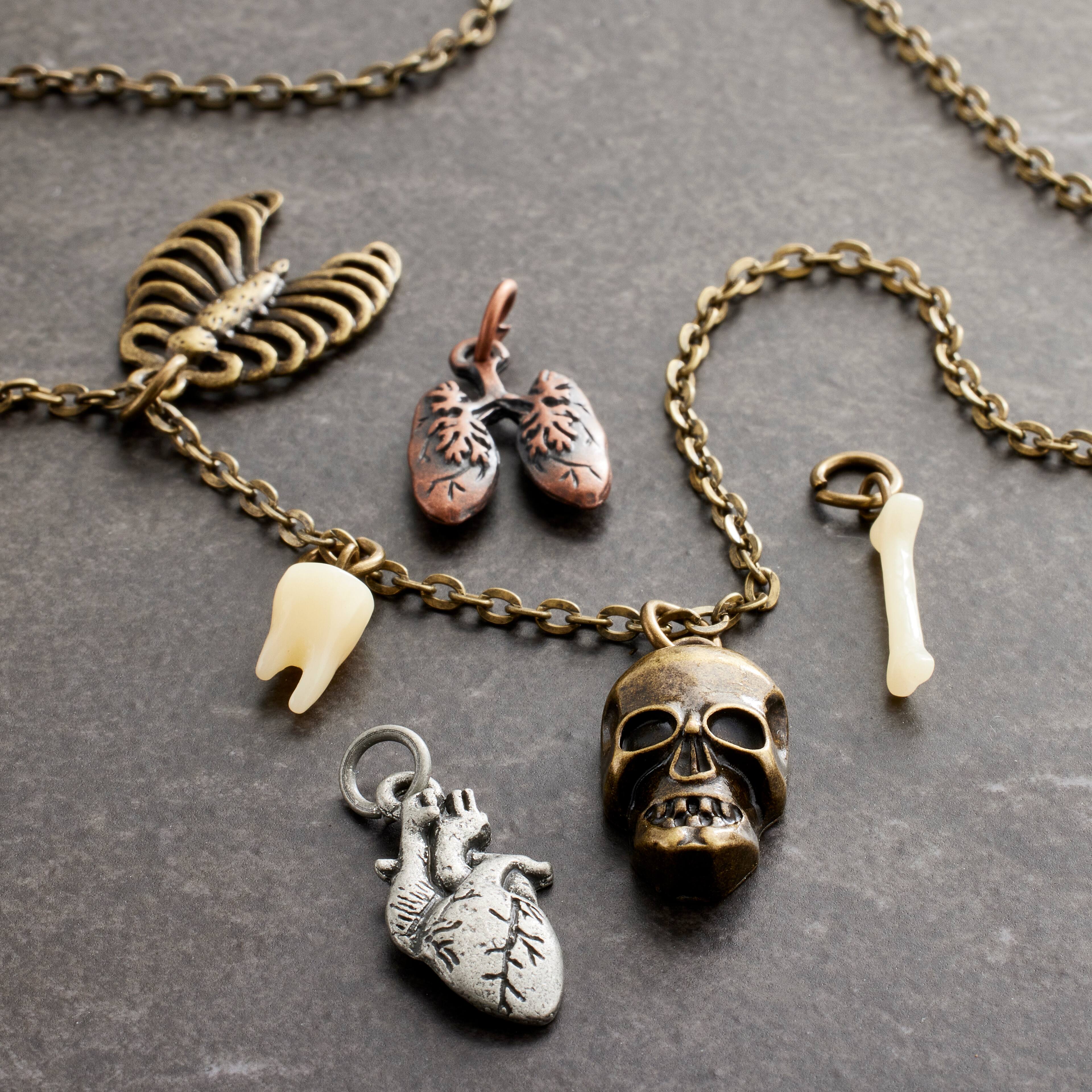 12 Packs: 6 ct. (72 total) Found Objects&#x2122; Bone Charms by Bead Landing&#x2122;