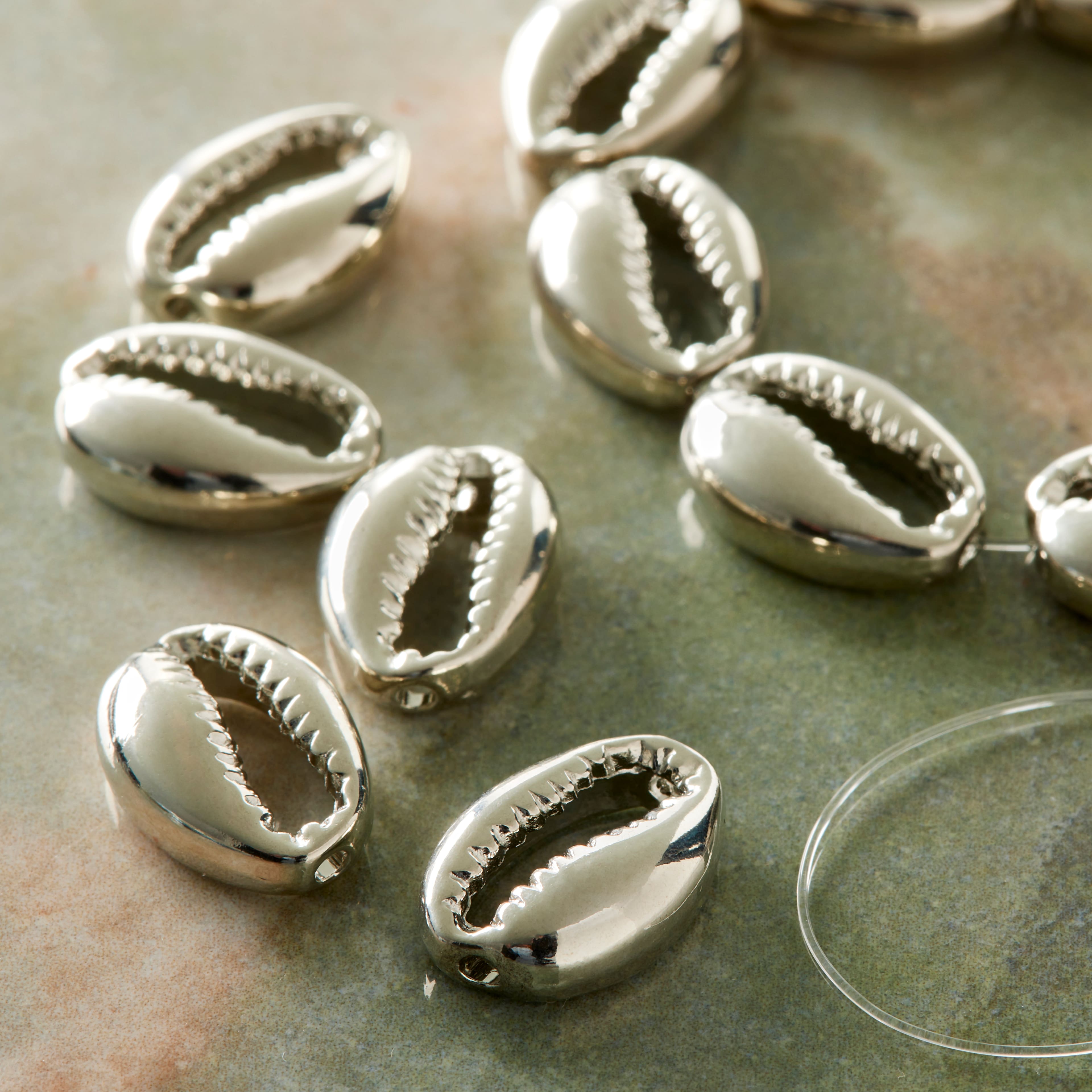 12 Packs: 11 ct. (132 total) Rhodium Zinc Alloy Cowry Shell, 17mm by Bead Landing&#xAE;
