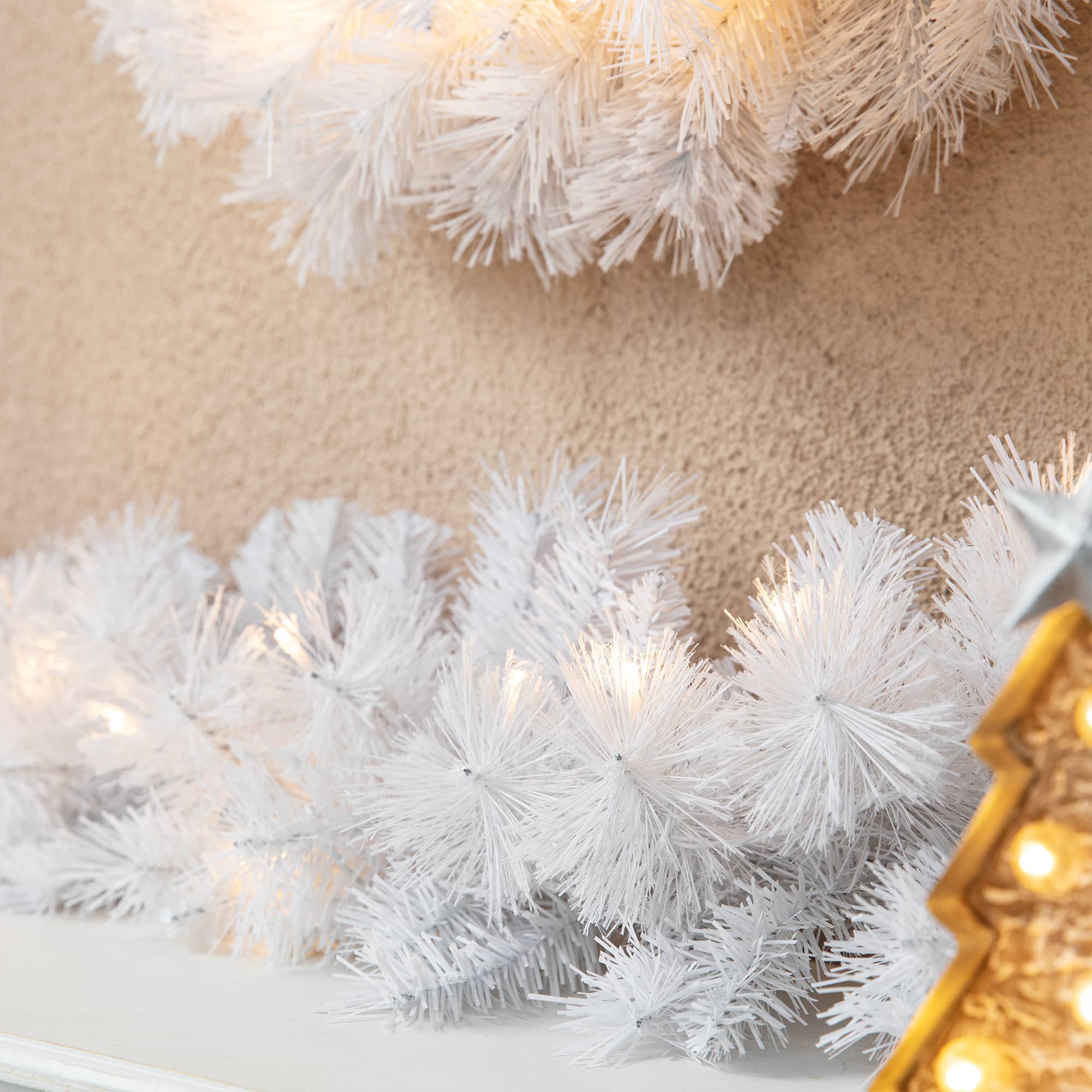 Glitzhome&#xAE; 9ft. Pre-Lit White Pine Christmas Garland with LED Lights and Timer