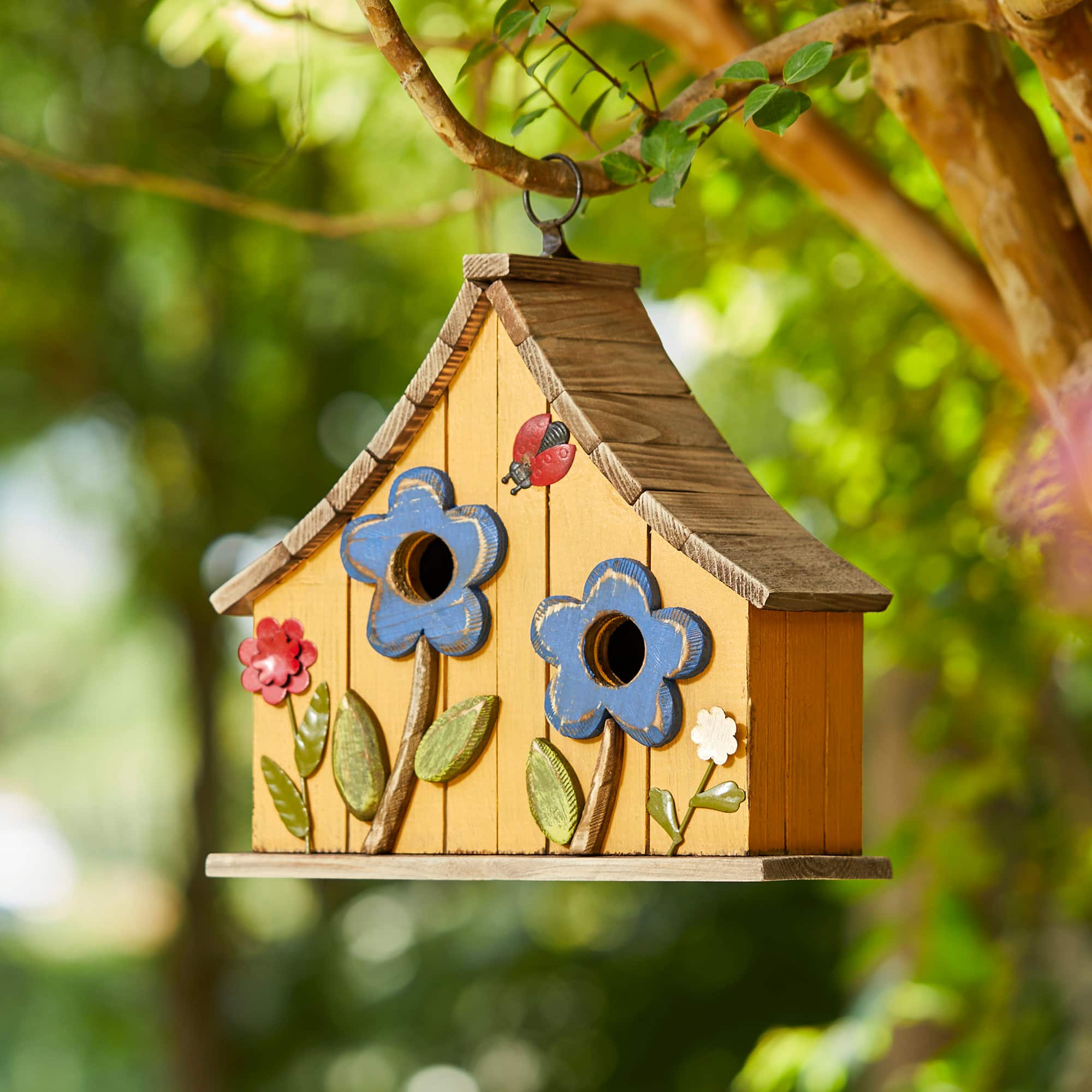 Glitzhome&#xAE; 10.5&#x22; Yellow Distressed Wood Birdhouse with Flowers