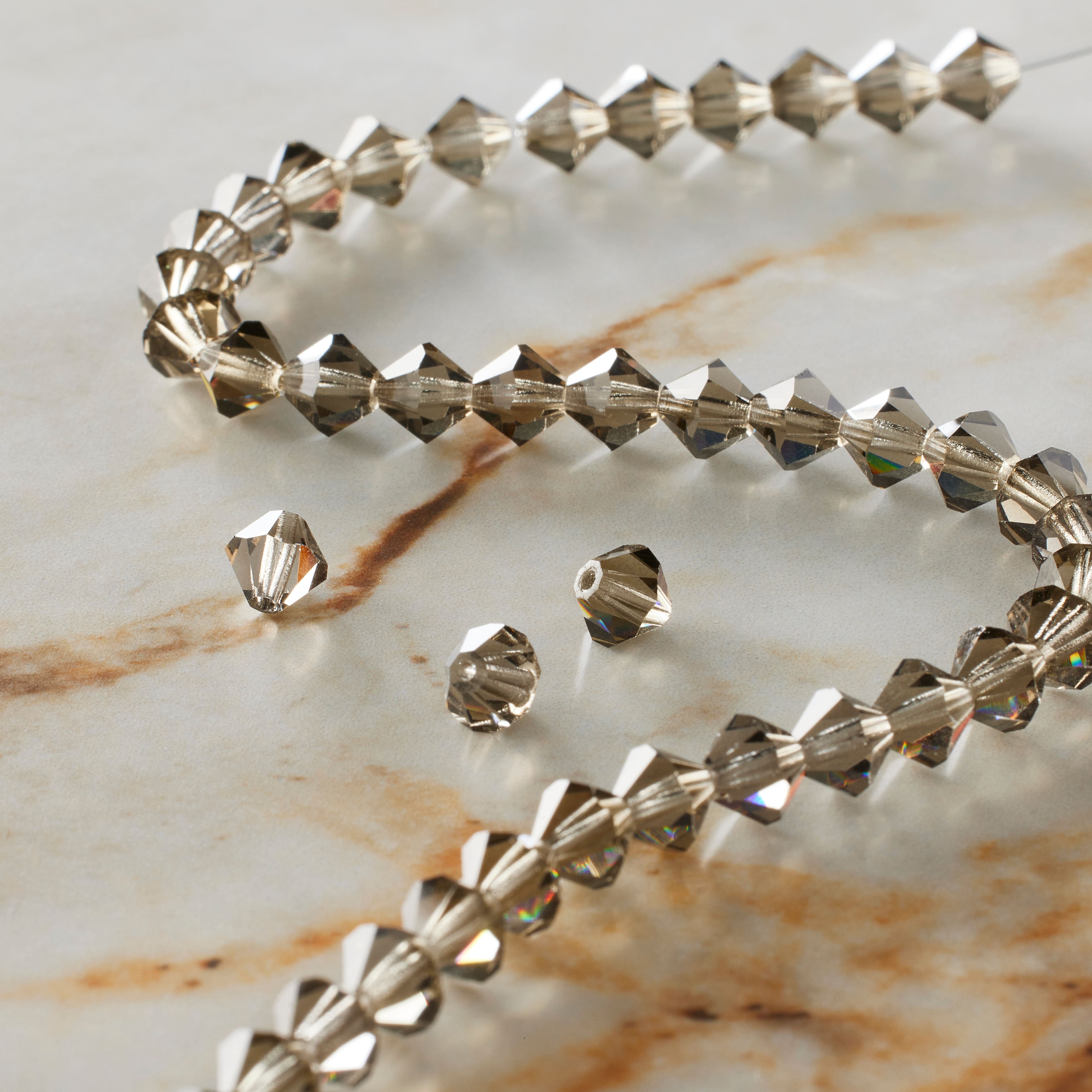 12 Pack: Preciosa Glass Crystal Bicone Beads, 6mm by Bead Landing™