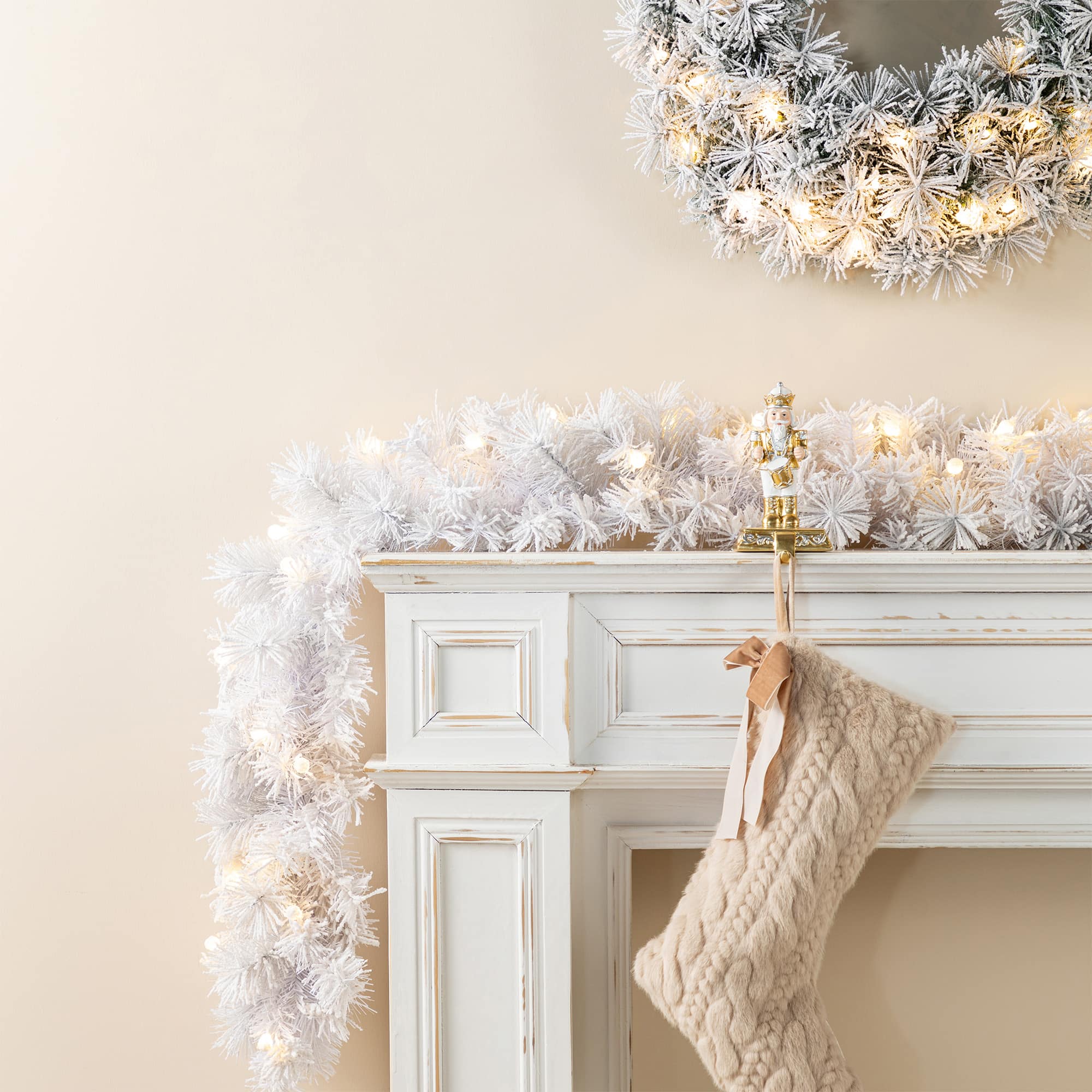 Glitzhome&#xAE; 9ft Pre-Lit Snow Flocked White Pine Christmas Garland with Timer