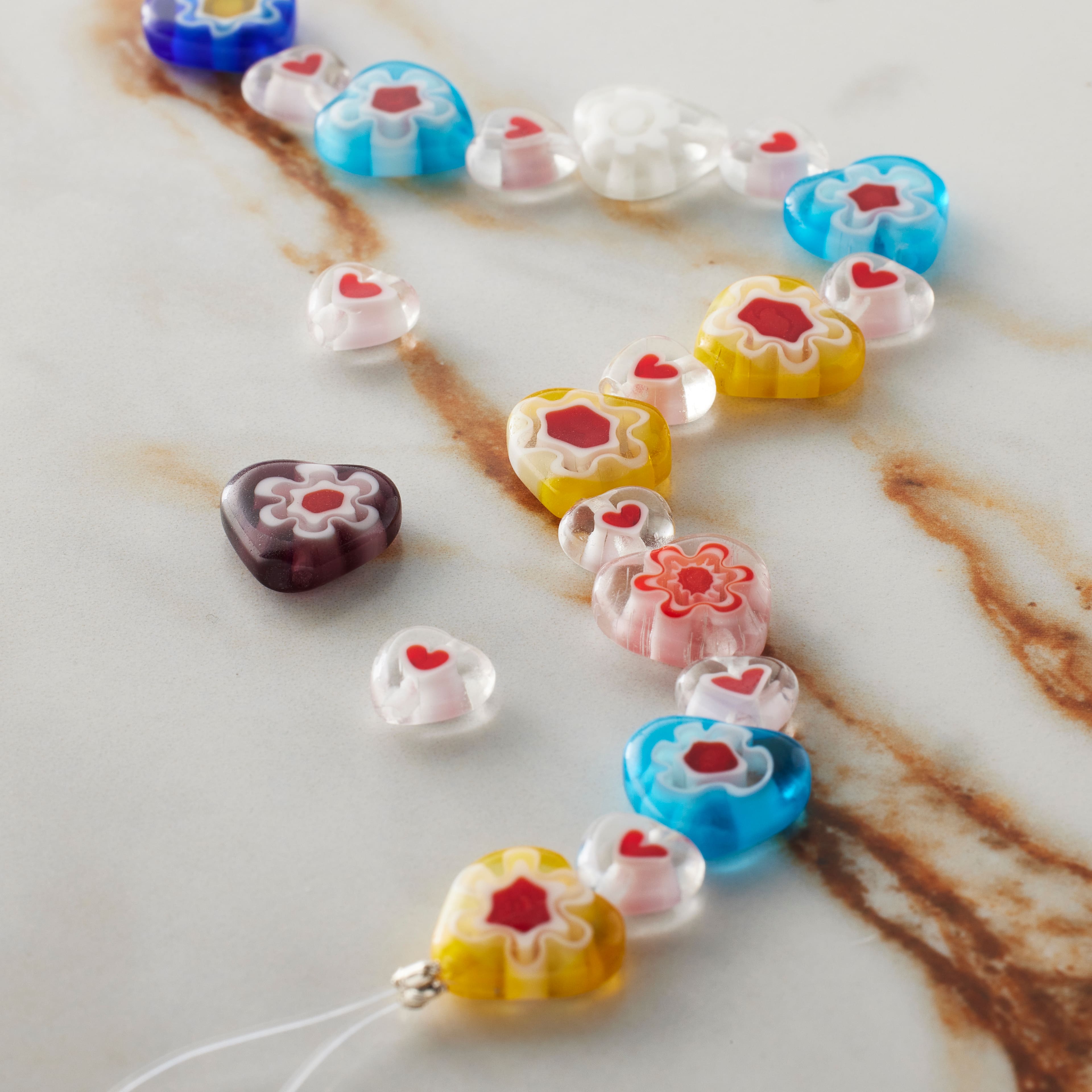 12 Packs: 20 ct. (240 total) Millefiori Flower Glass Heart Beads by Bead Landing™