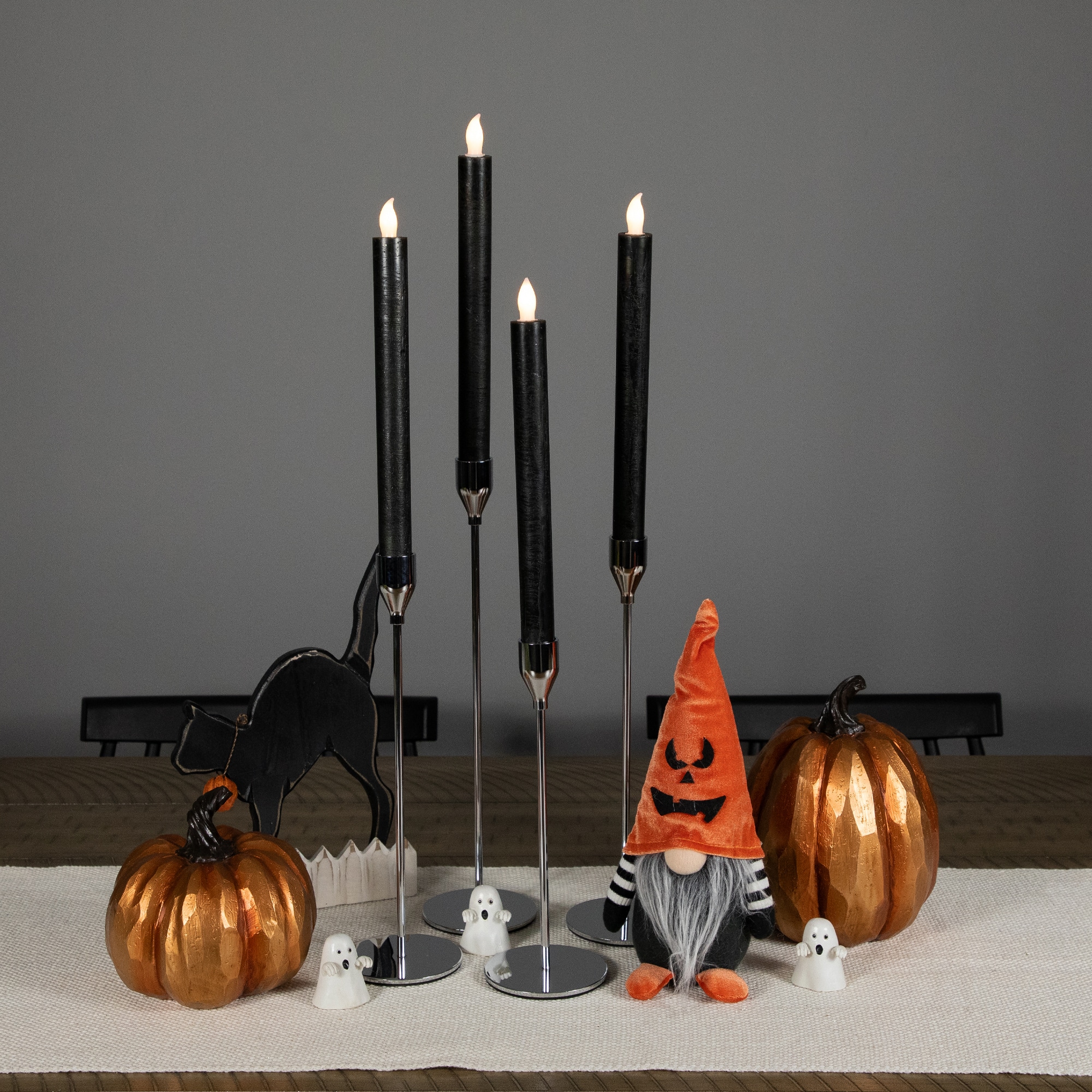 9.5&#x22; Solid Black LED Flickering Flameless Halloween Taper Candles, 4ct.