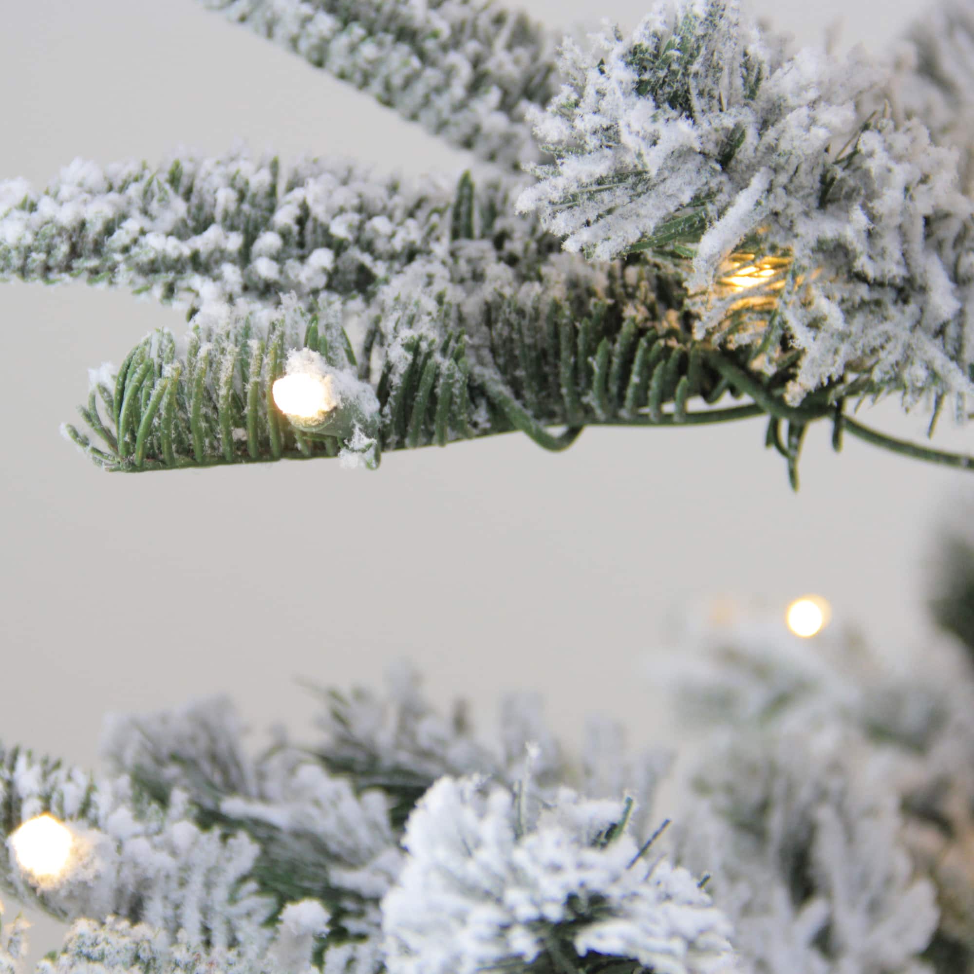 6.5ft. Pre-Lit Flocked Nordmann Fir Artificial Christmas Tree, Warm White LED Lights