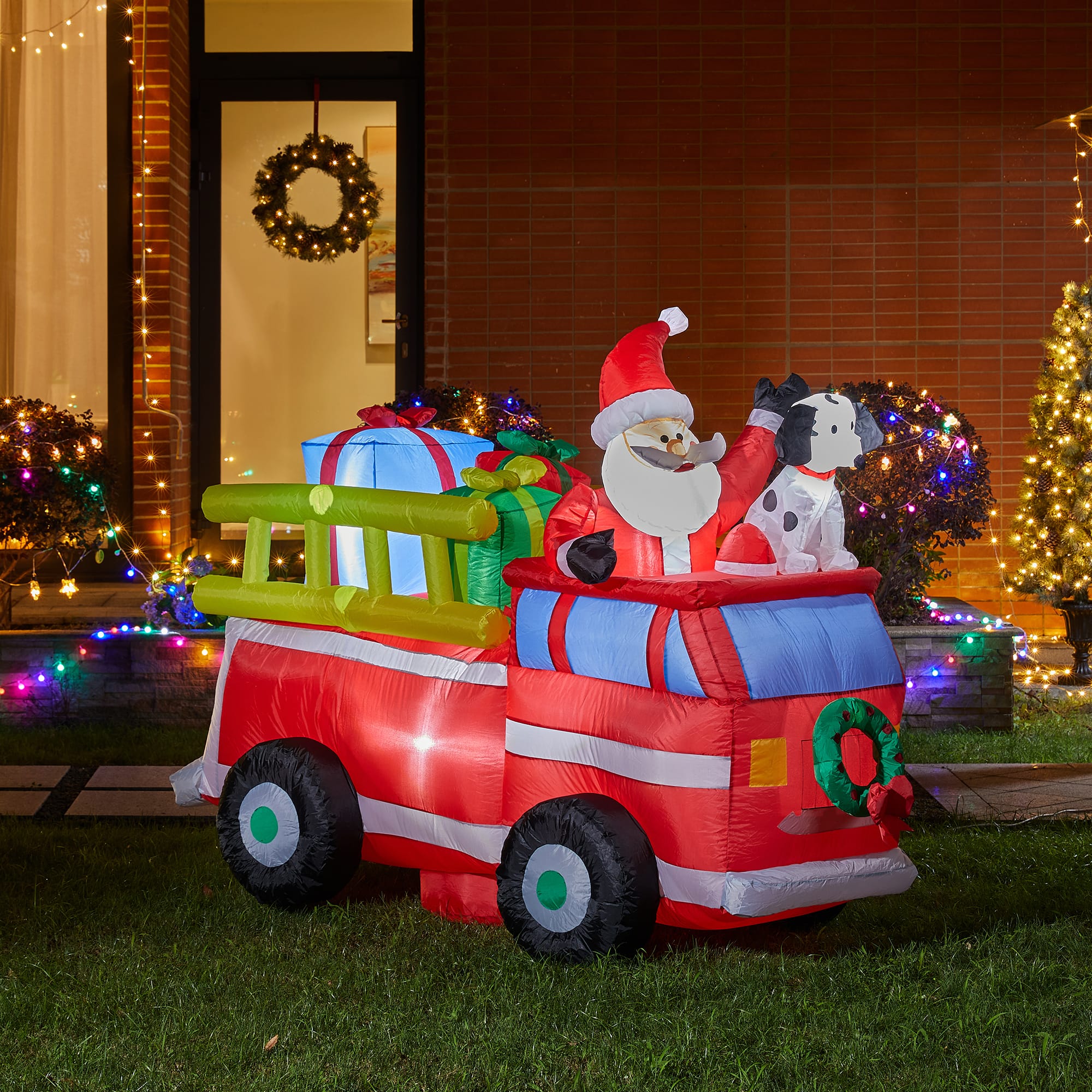 Glitzhome&#xAE; 7ft. Inflatable Santa in Truck With Lights