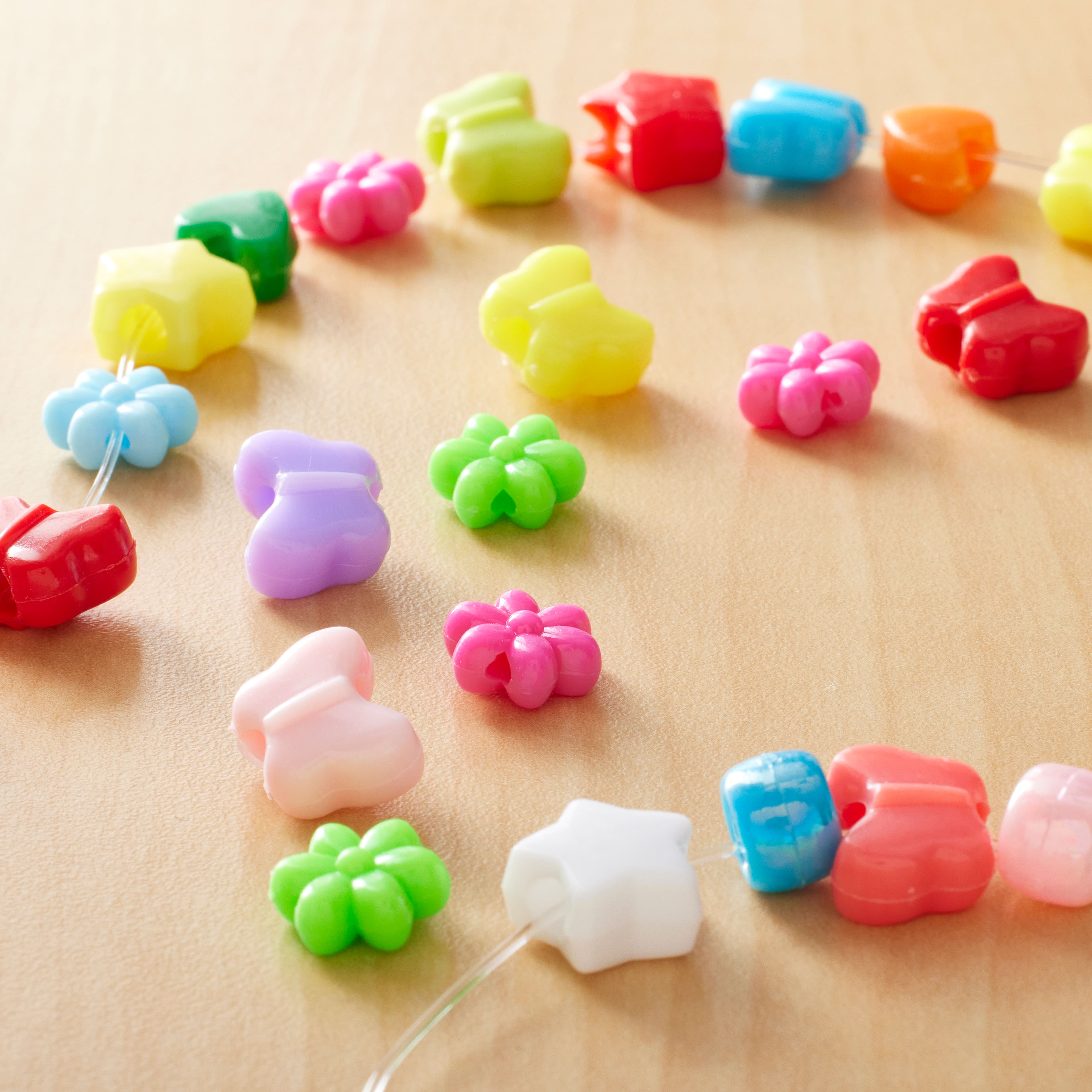 12 Packs: 150 ct. (1,800 total) Bright Shaped Beads by Creatology&#x2122;