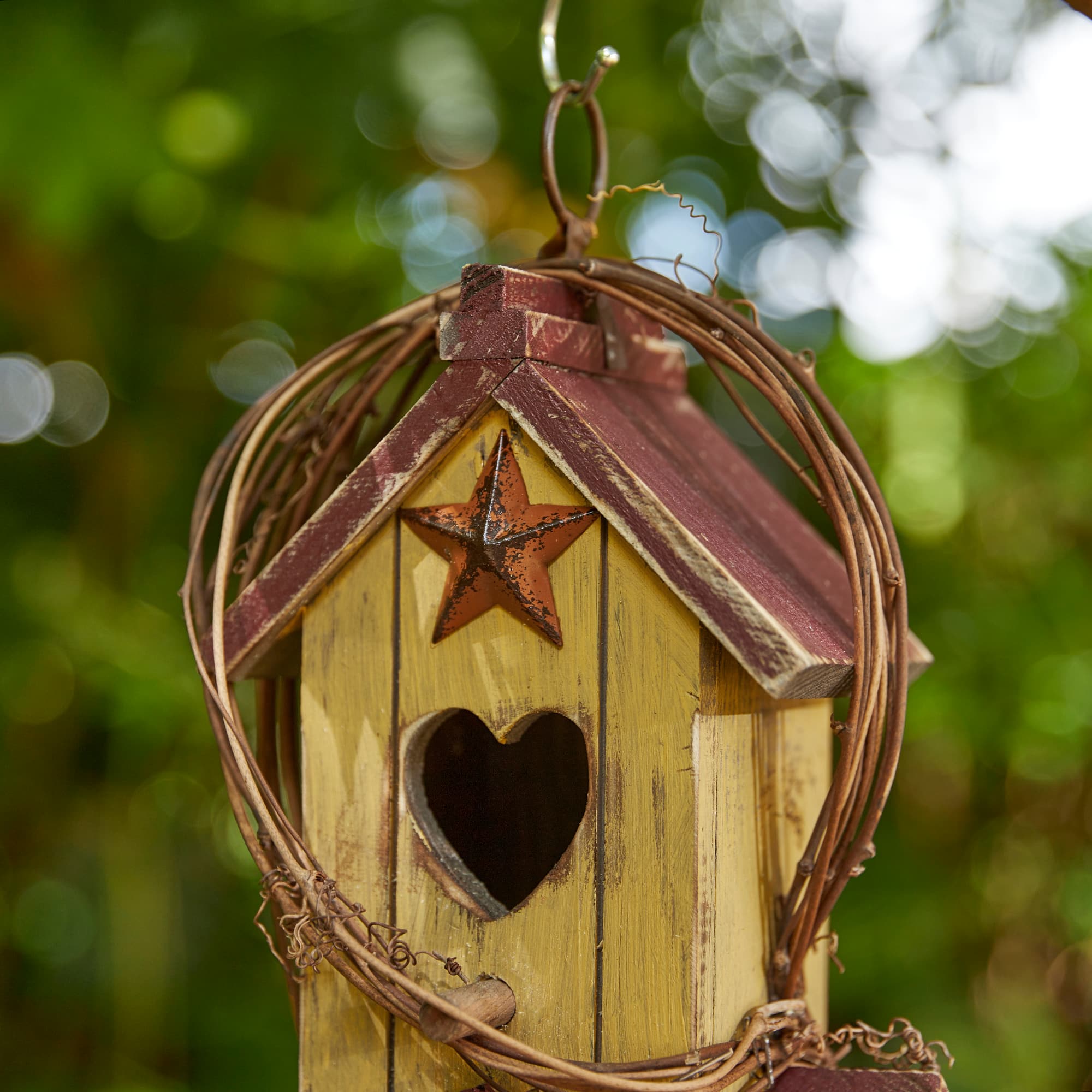 Glitzhome&#xAE; 11.5&#x22; Yellow Washed with Rattan Distressed Wood Cottage Birdhouse
