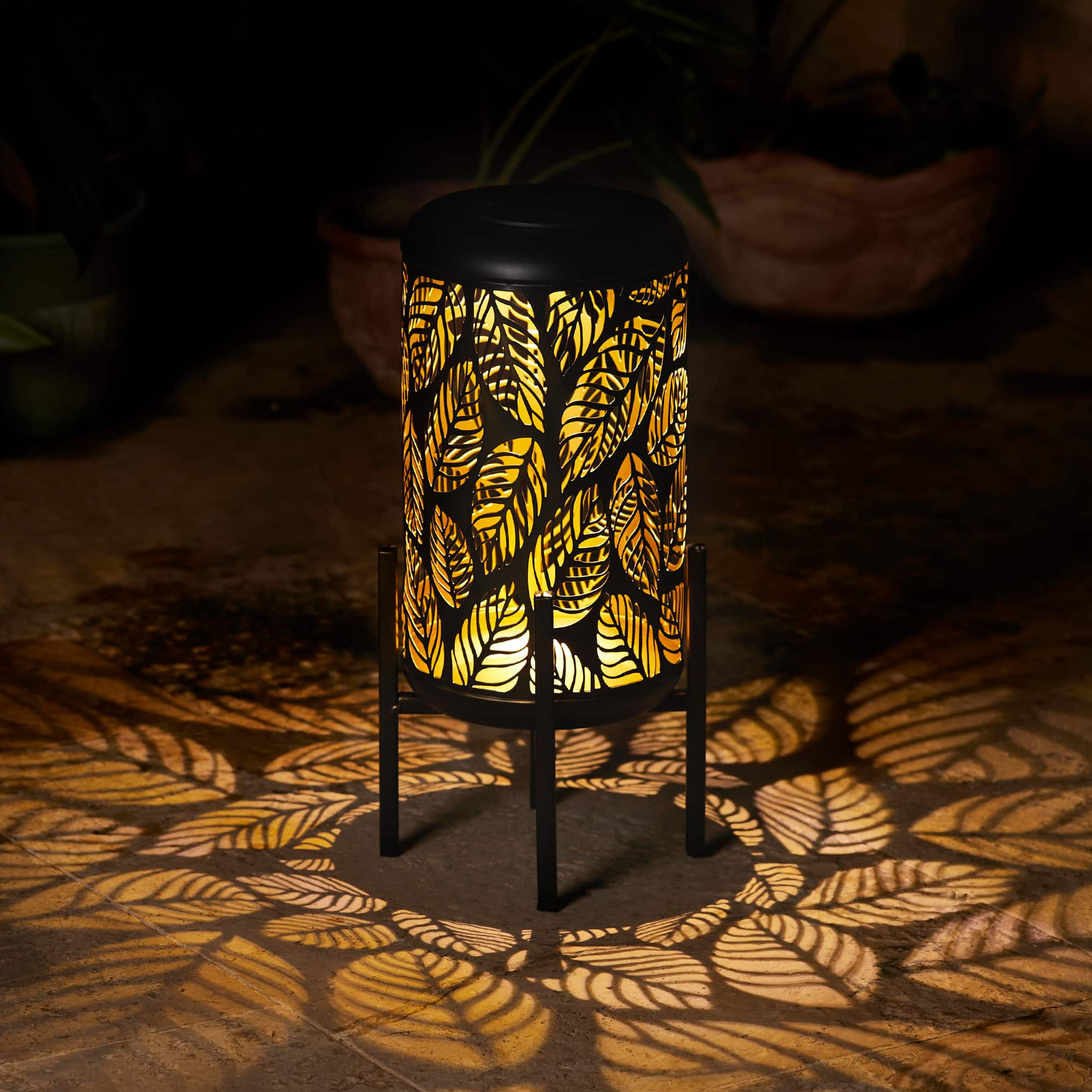 Glitzhome&#xAE; 14.25&#x22; Black Metal Cutout Leaves Pattern Solar Powered LED Outdoor Lantern